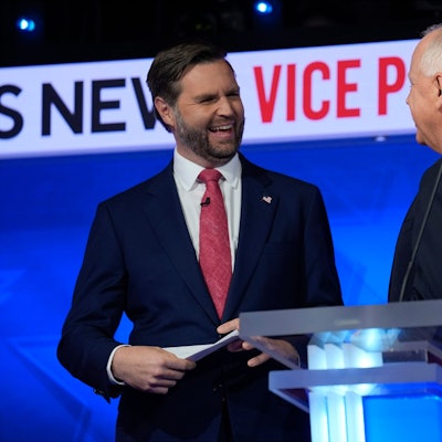 Republican vice presidential nominee Sen. JD Vance, R-Ohio, talks with Democratic vice presidential candidate Minnesota Gov. Tim Walz after the vice presidential debate hosted by CBS News Tuesday, Oct. 1, 2024, in New York. (AP Photo/Matt Rourke)
