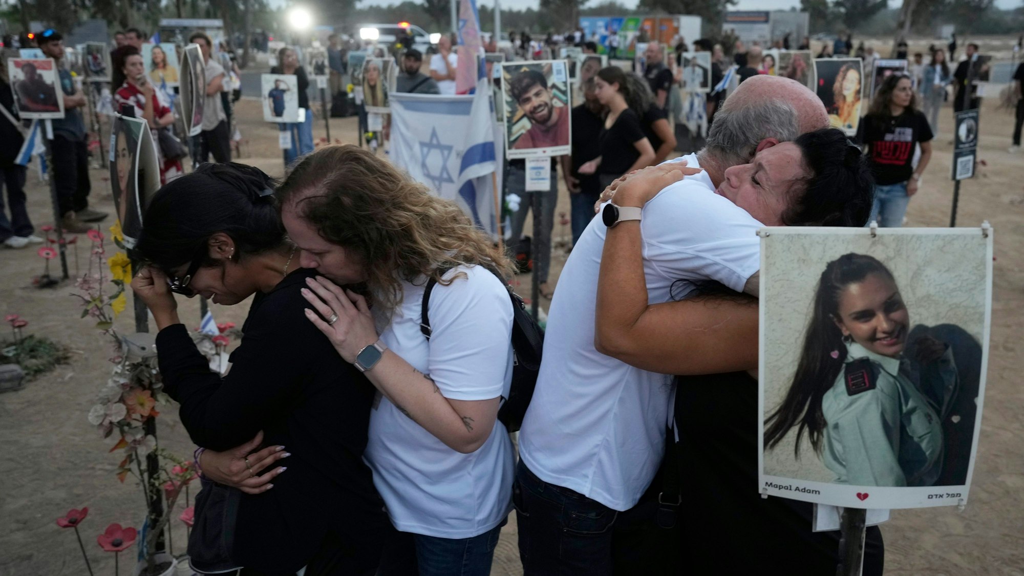 People visit the site of the Nova music festival, where hundreds of revelers were killed and abducted by Hamas and taken into Gaza, on the one-year anniversary of the attack, near Kibbutz Reim, southern Israel, Monday, Oct. 7, 2024. (AP Photo/Ariel Shalit)