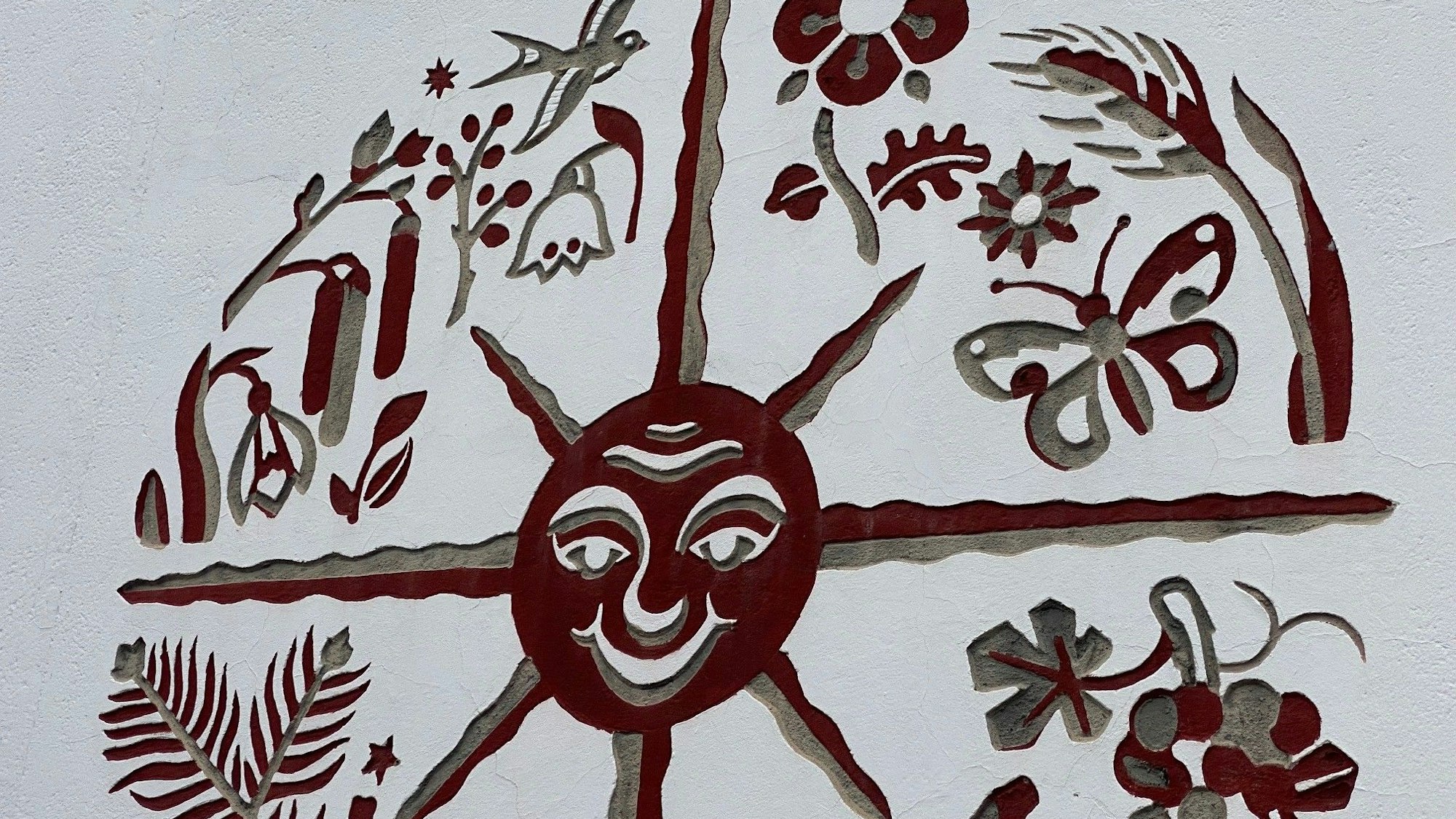 Zu sehen ist das Symbol einer Sonne.