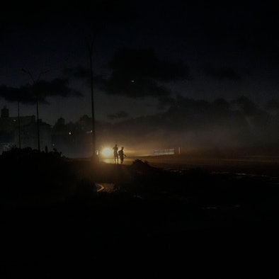Residents walk on a street during a blackout following the failure of a major power plant in Havana, Cuba, Sunday, Oct. 20, 2024. (AP Photo/Ramon Espinosa)