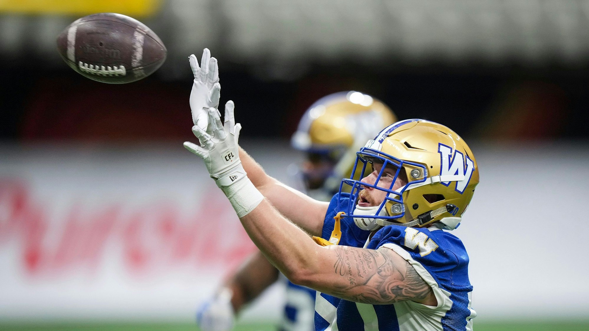Winnipeg Blue Bombers linebacker Fabian Weitz catches a ball during football practice ahead of the 1111th Grey Cup CFL football game in Vancouver, Tuesday, Nov. 12, 2024. (Darryl Dyck/The Canadian Press via AP)