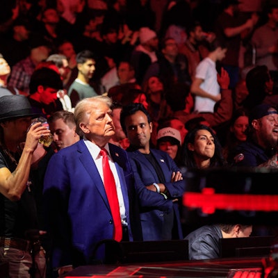US President-elect Donald Trump, singer Kid Rock and US entrepreneur Vivek Ramaswa stand up after UFC Heavyweight Champion Jon Jones' TKO victory against challenger Stipe Miocic in the UFC 309 heavyweight title bout at Madison Square Garden in New York, on November 16, 2024. US President-elect Donald Trump was greeted by chanting fans as he attended the Ultimate Fighting Championship heavyweight bout at New York's Madison Square Garden on November 16.
Trump entered the arena shortly before the start of the main card accompanied by UFC chief executive Dana White, who was a prominent backer during his election campaign.
Several political allies of Trump were also in attendance including entrepreneurs Elon Musk and Vivek Ramaswamy, who have been asked by Trump to lead efforts to cut government inefficiency. (Photo by Kena Betancur / AFP)