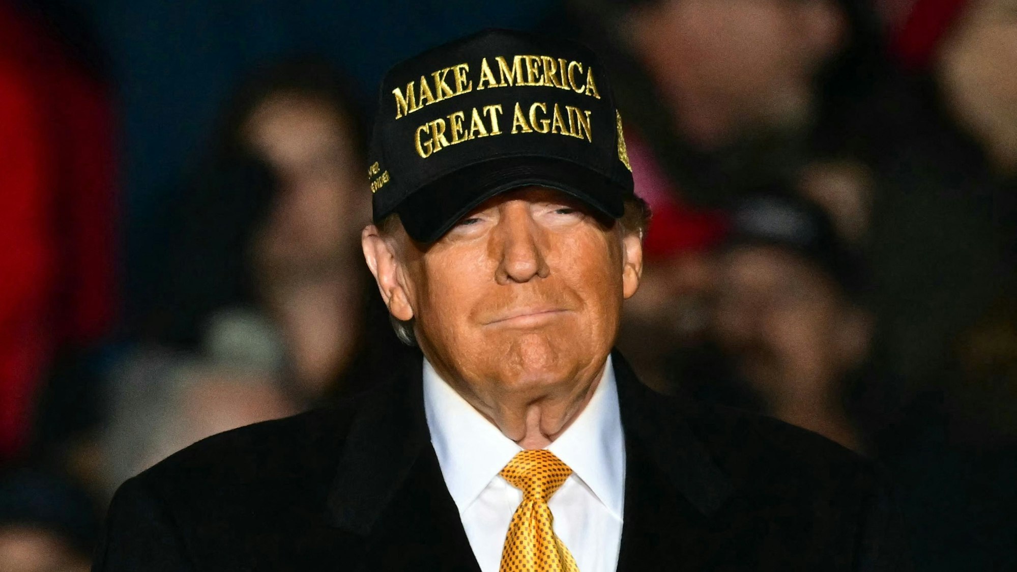 (FILES) Former US President Republican presidential candidate Donald Trump arrives, more than 3 hours late, to a campaign rally in Traverse City, Michigan on October 25, 2024. Donald Trump's victory in the US presidential election, the continuing war in the Middle East or the Paris Olympics... are among the twelve events that marked the year 2024. (Photo by Jim WATSON / AFP)