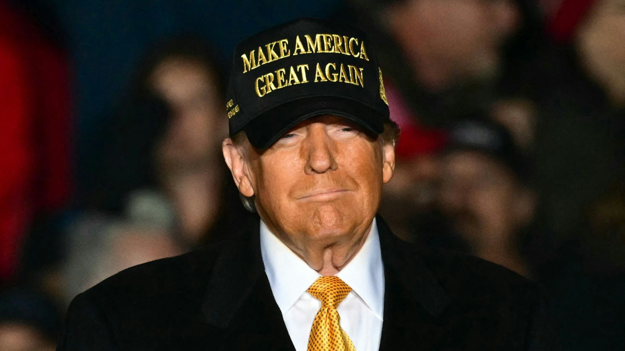 (FILES) Former US President Republican presidential candidate Donald Trump arrives, more than 3 hours late, to a campaign rally in Traverse City, Michigan on October 25, 2024. Donald Trump's victory in the US presidential election, the continuing war in the Middle East or the Paris Olympics... are among the twelve events that marked the year 2024. (Photo by Jim WATSON / AFP)