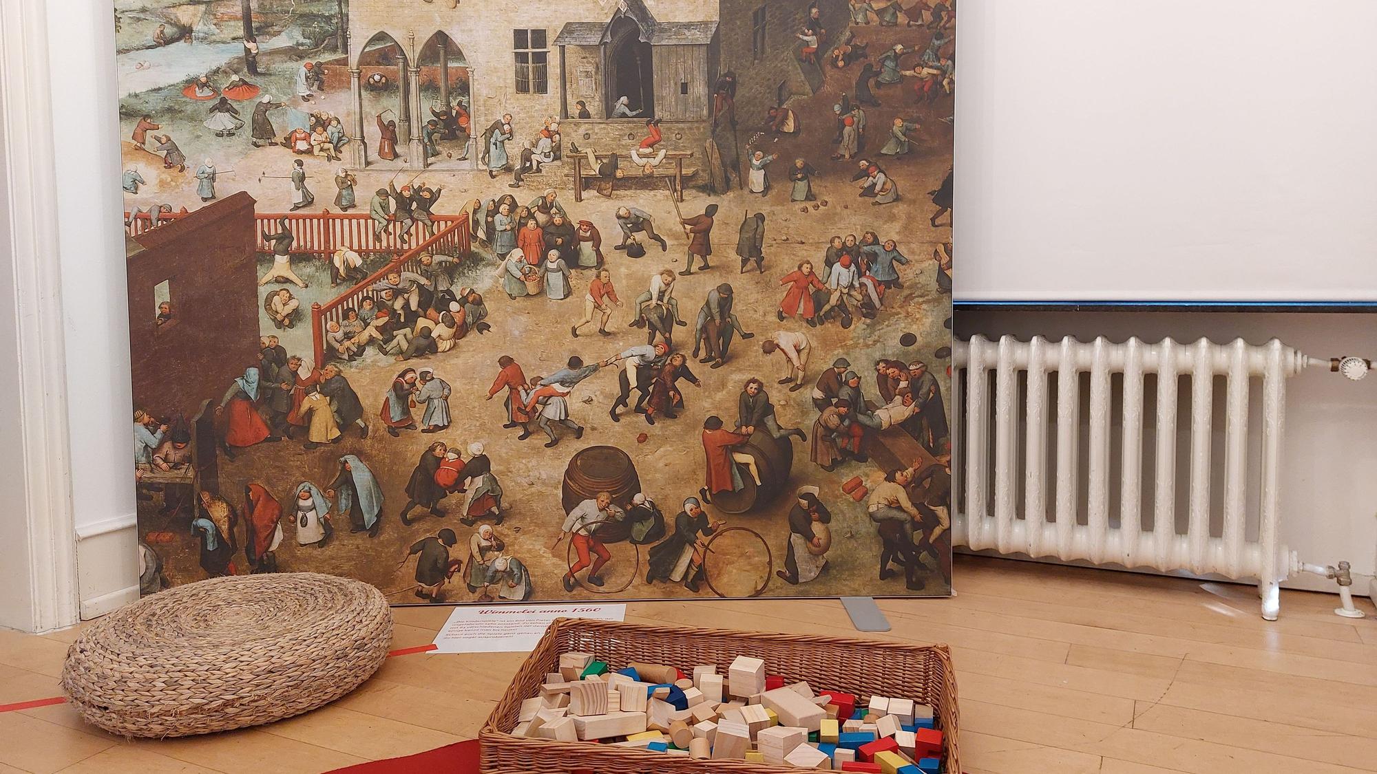 Eine Reproduktion eines Gemäldes mit spielenden Kindern.