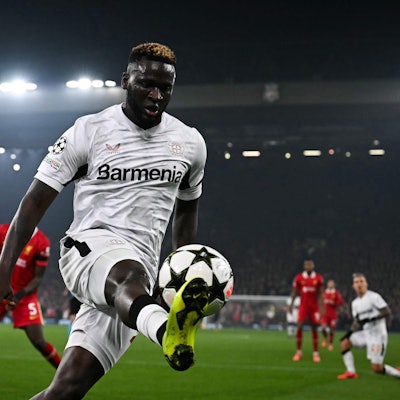 TOPSHOT - Bayer Leverkusen's Nigerian forward #22 Victor Boniface controls the ball during the UEFA Champions League football match between Liverpool and Bayer Leverkusen at Anfield stadium, in Liverpool, north west England, on November 5, 2024. (Photo by Paul ELLIS / AFP)