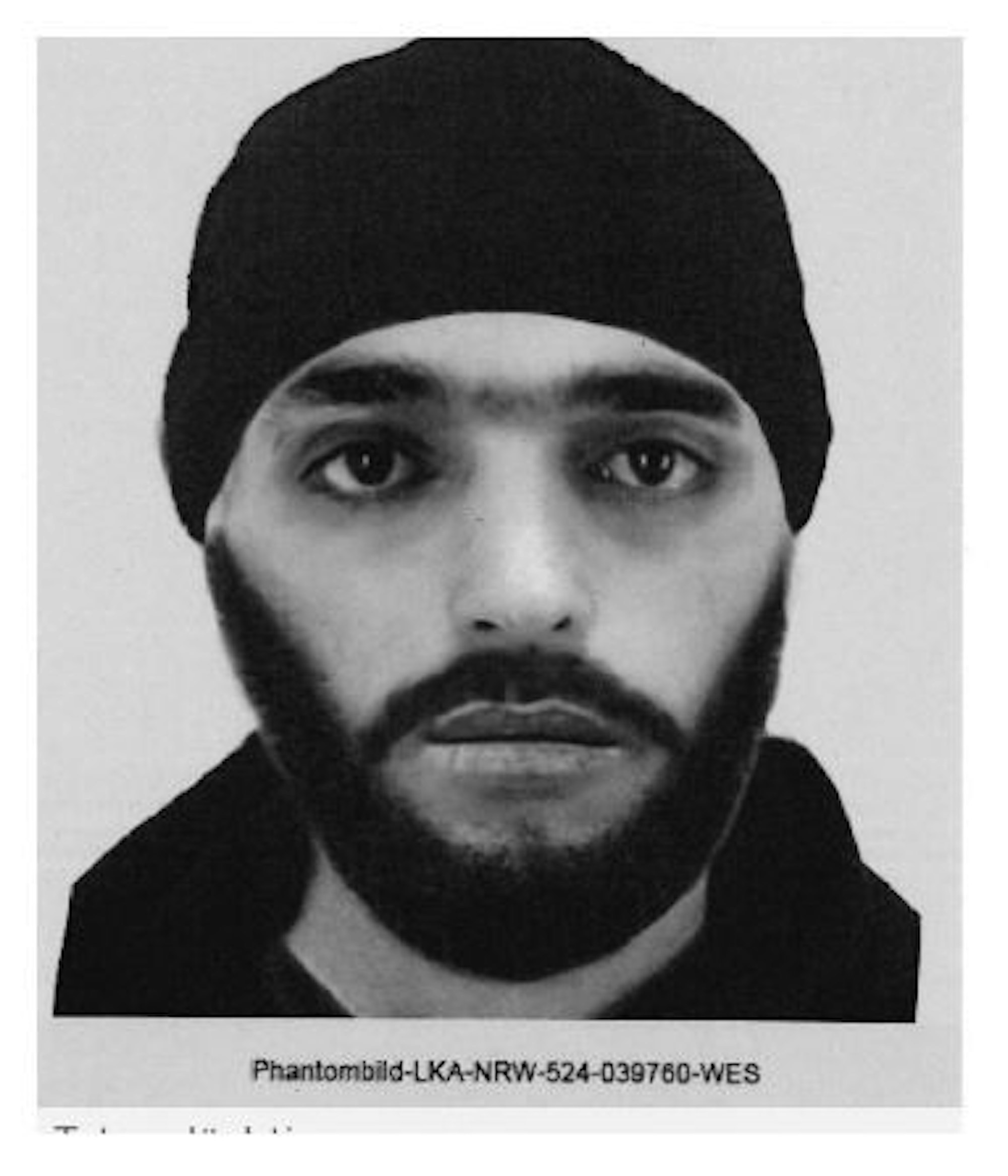 Das Foto zeigt einen bärtigen Mann mit Mütze.