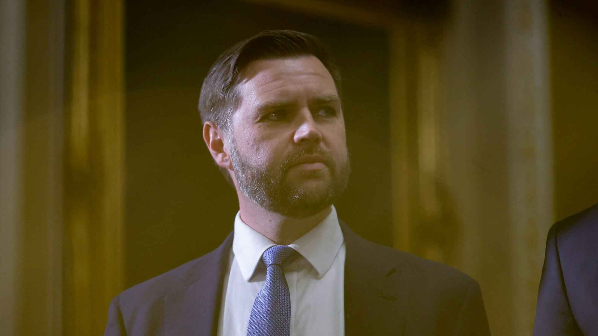 US Vice President-elect JD Vance watches US President-elect Donald Trump (off frame) speak to the press after paying their respects in front of the flag-draped casket at the Lying in State Ceremony for former President Jimmy Carter at the US Capitol Rotunda in Washington, DC on January 8, 2025. Carter, the 39th President of the United States, died at the age of 100 on December 29, 2024 at his home in Plains, Georgia. (Photo by Ting Shen / AFP)