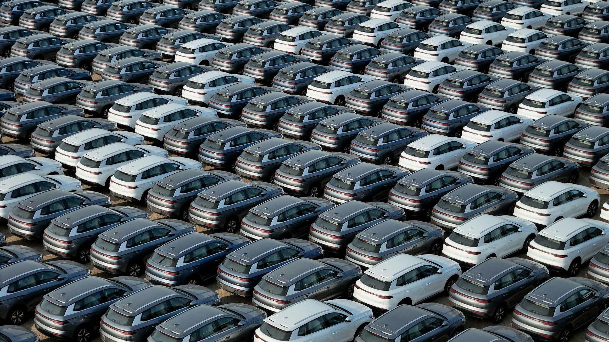 (FILES) This photo taken on April 18, 2024 shows BYD electric cars for export waiting to be loaded onto a ship at a port in Yantai, in eastern China's Shandong province.