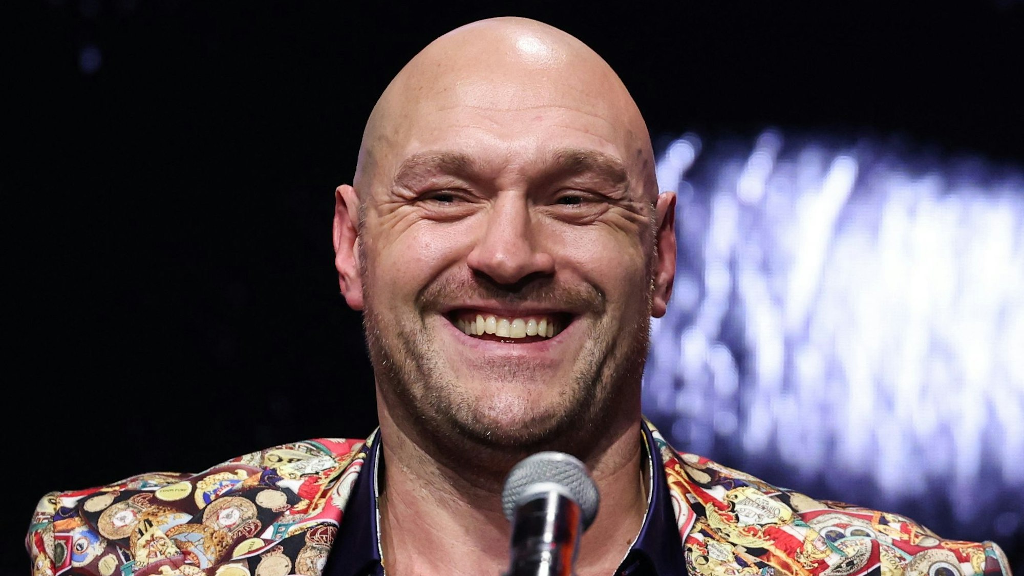 (FILES) Britain's Tyson Fury reacts during a press conference, in London, on November 16, 2023, ahead of his undisputed heavyweight world championship contest against Ukraine's Oleksandr Usyk, taking place in early February 17, 2024 in Riyadh, Saudi Arabia. Former world heavyweight champion Tyson Fury said Monday, January 13, he had retired from boxing. "I'm going to make this short and sweet," said British fighter Fury in a social media post. "I'd like to announce my retirement from boxing. It's been a blast, I've loved every single minute of it." (Photo by Daniel LEAL / AFP)