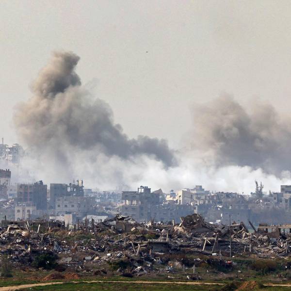 This picture taken from the Israeli side of the border with the Gaza Strip shows smoke plumes rising from explosions above destroyed buildings in the northern Gaza Strip on January 14, 2025, amid the ongoing war between Israel and Hamas. (Photo by Jack GUEZ / AFP)