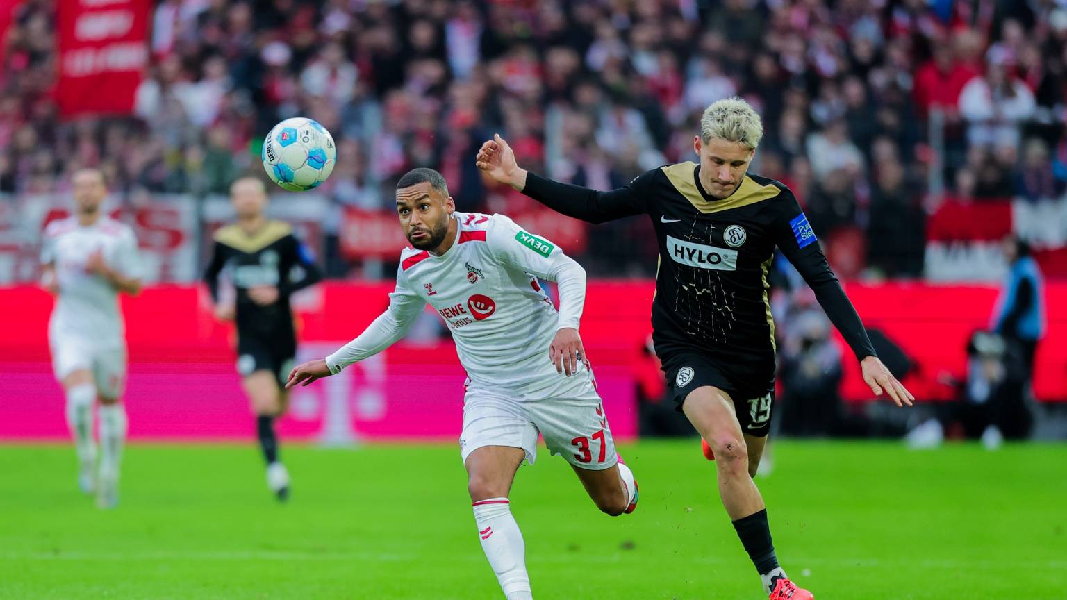 Wieder fit und bereit für Braunschweig: FC-Angreifer Linton Maina (l), hier im Duell mit Elversbergs Lukas Pinckert.
