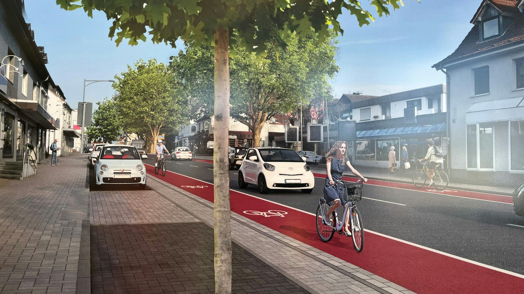 Parkbuchten, Fahrradstreifen und Autoverkehr sind zu sehen.