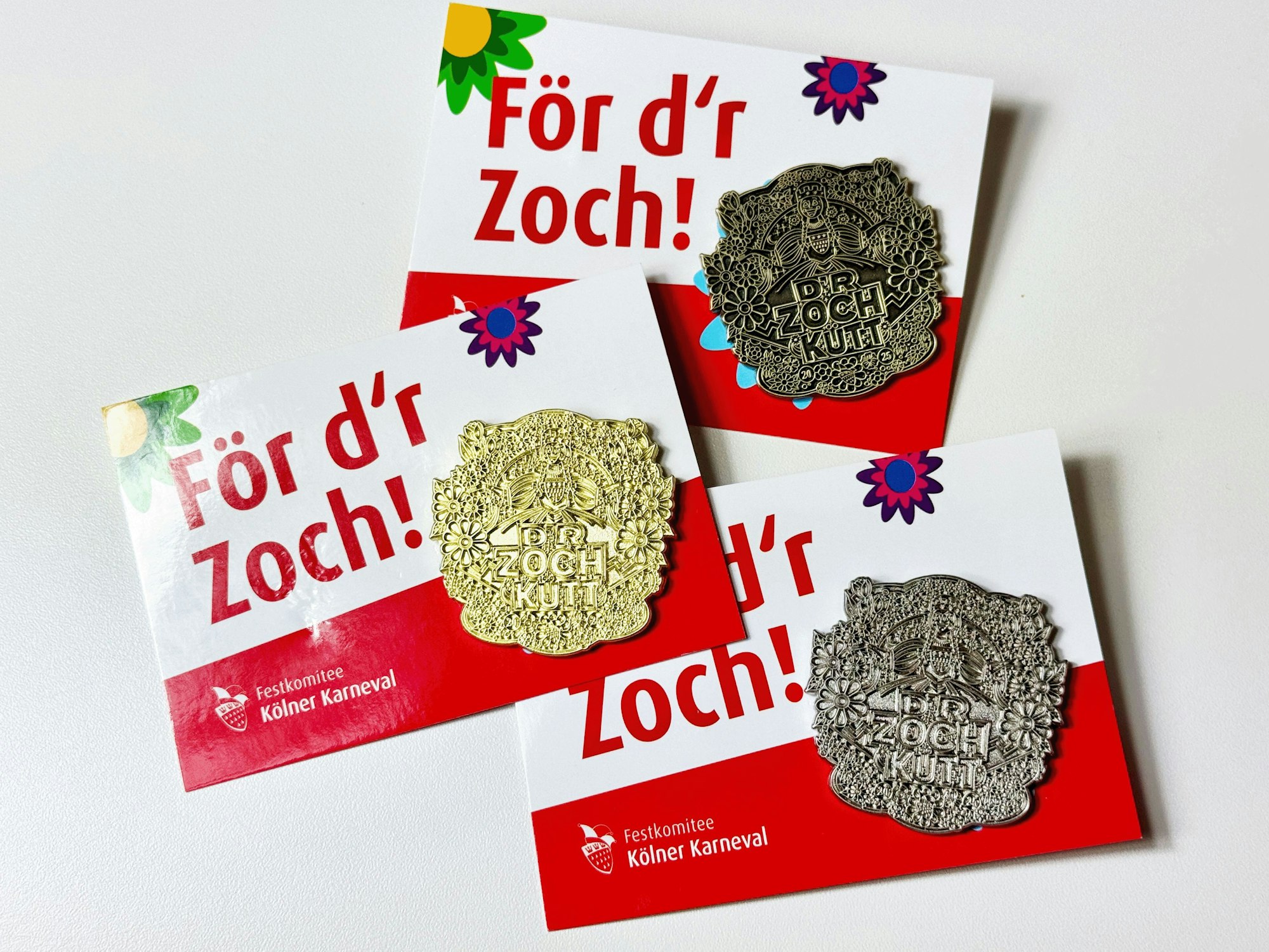 Die Rosenmontags-Spange in Bronze, Silber und Gold.