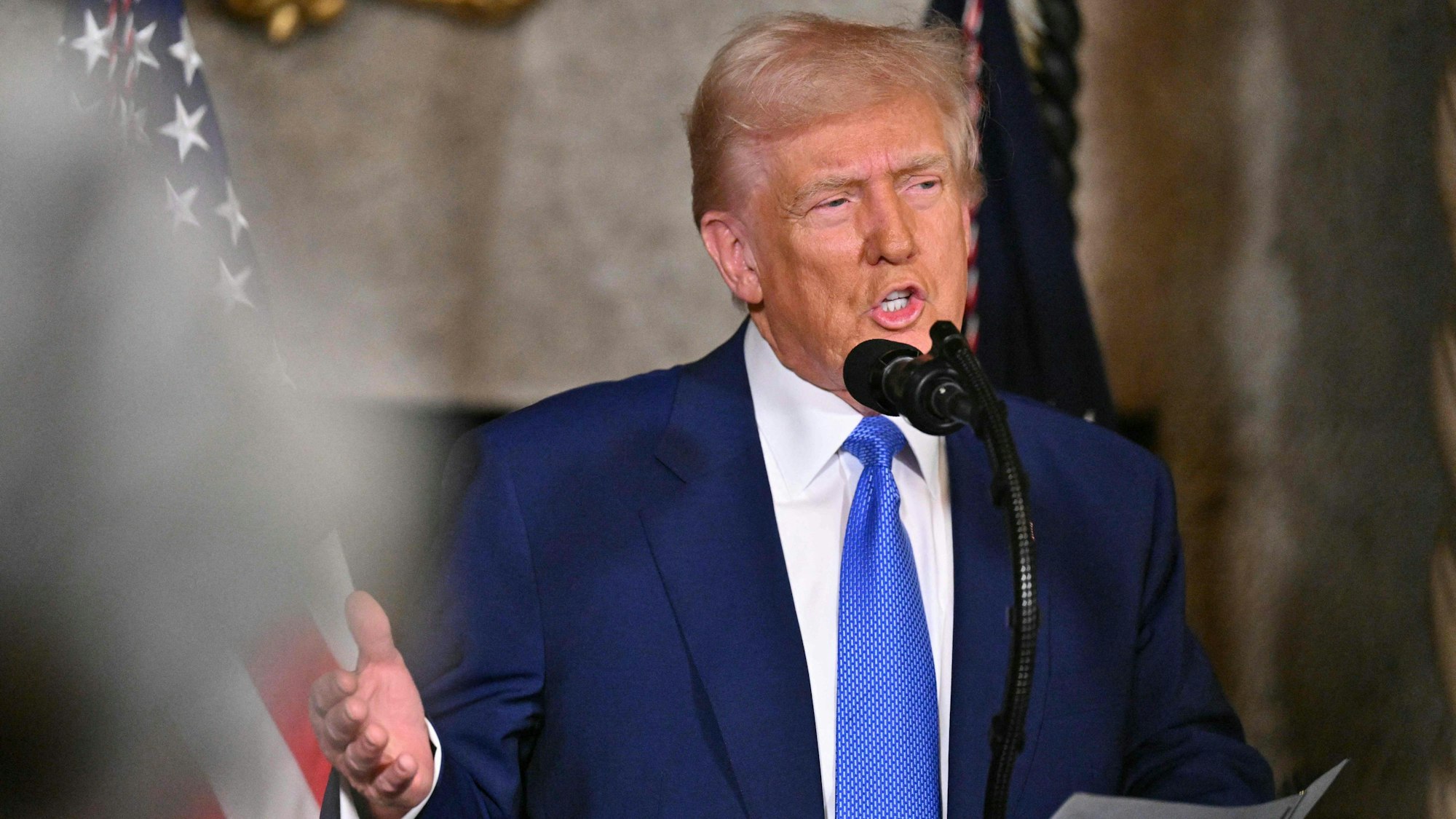 US President Donald Trump takes a question as he speaks during the signing of executive orders at his Mar-a-Lago resort in Palm Beach, Florida, on February 18, 2025. Trump signed an executive order February 18 aimed at improving the affordability and availability of in vitro fertilization, a health issue he had addressed on the campaign trail. (Photo by ROBERTO SCHMIDT / AFP)