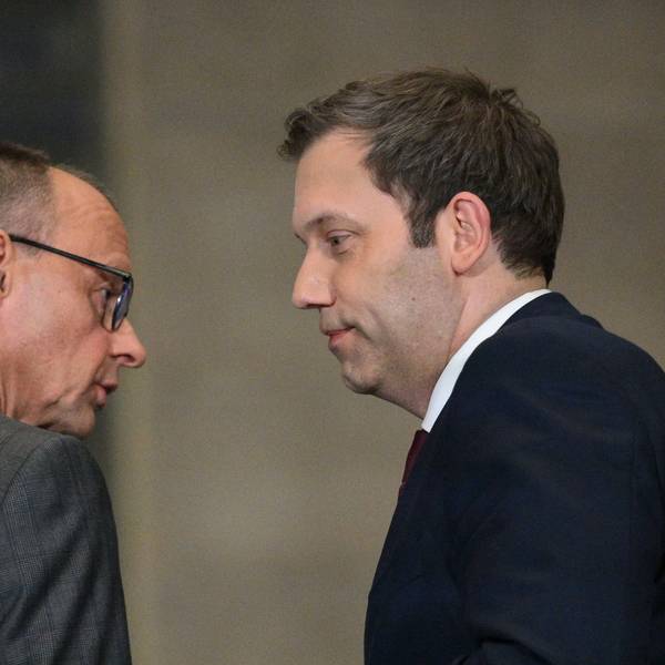 Leader of Germany's Christian Democratic Union (CDU) Friedrich Merz (L) and Germany's Social Democratic Party (SPD) Chairman Lars Klingbeil look at each other as they hold a press conference on planned major investments, in Berlin, on March 4, 2025. Germany's likely next chancellor Friedrich Merz said on March 4, 2025 his centre-right CDU/CSU and the centre-left Social Democrats (SPD) would propose hundreds of billions in extra spending on defence and the economy. (Photo by RALF HIRSCHBERGER / AFP)