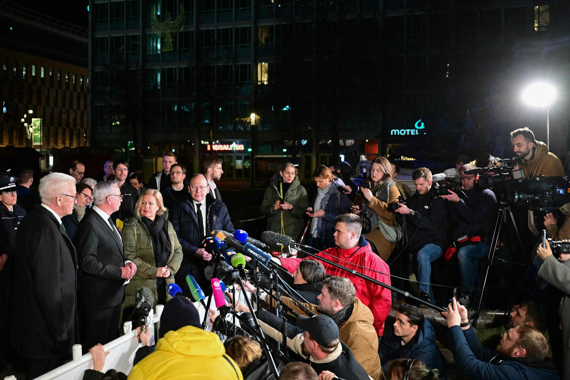 (L-R) Baden-Wuerttemberg's State Premier Winfried Kretschmann, Baden-Wuerttemberg's Interior Minister Thomas Strobl, German Interior Minister Nancy Faeser and Mannheim's Mayor Christian Specht speak to journalists as they visit the scene of a car ramming attack in Mannheim, southwestern Germany on March 3, 2025. A car driven into a crowd in southwest Germany on Monday killed two people, authorities said, adding they had arrested a 40-year-old German man after the incident. (Photo by Thomas LOHNES / AFP)