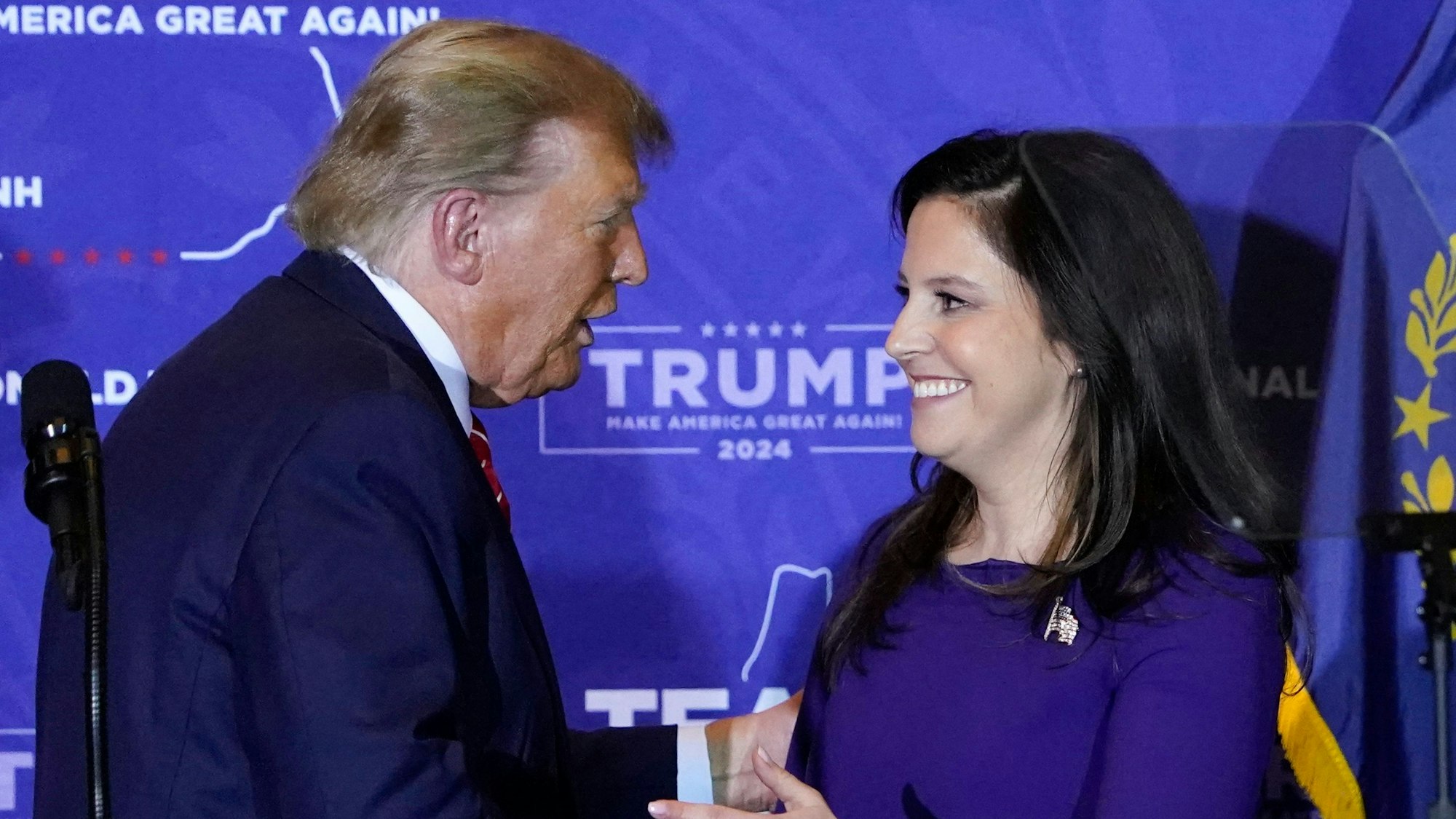 (FILES) US Republican presidential hopeful and former US President Donald Trump greets US Representative Elise Stefanik (R-NY) during a campaign event in Concord, New Hampshire, on January 19, 2024. President Donald Trump on March 27, 2025 withdrew his nominee for US ambassador to the United Nations, citing concerns about the narrow Republican majority in Congress if Elise Stefanik gives up her place. (Photo by TIMOTHY A. CLARY / AFP)