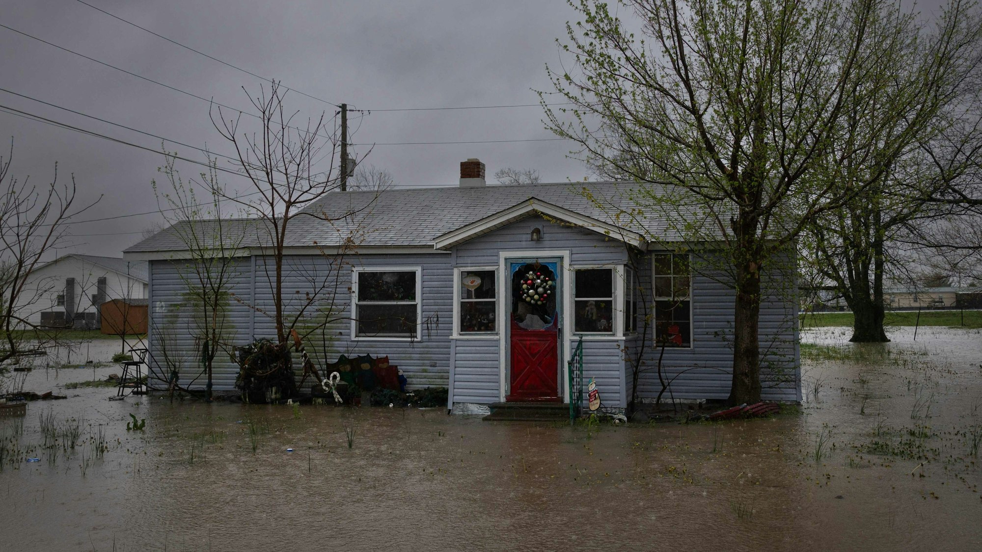 WILSON CITY, MISSOURI - APRIL 05: Water surrounds a home on April 05, 2025 in Wilson City, Missouri. Between 6 and 9 inches of rain have fallen around southeastern Missouri, southern Illinois and western Kentucky, causing flooding of rivers, creeks, streams, and other low-lying and flood-prone locations. Scott Olson/Getty Images/AFP (Photo by SCOTT OLSON / GETTY IMAGES NORTH AMERICA / Getty Images via AFP)