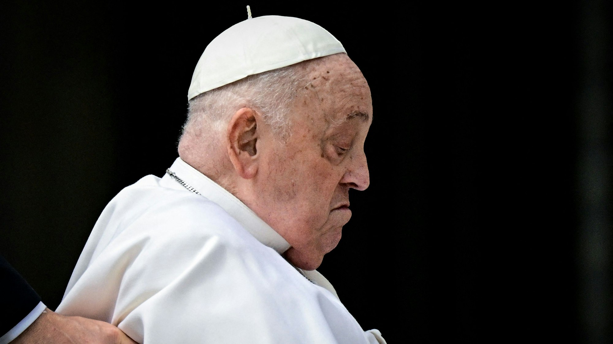 Pope Francis makes a surprise appearance at the end of the mass for Palm Sunday at St Peter's square in the Vatican on April 13, 2025. (Photo by Tiziana FABI / AFP)