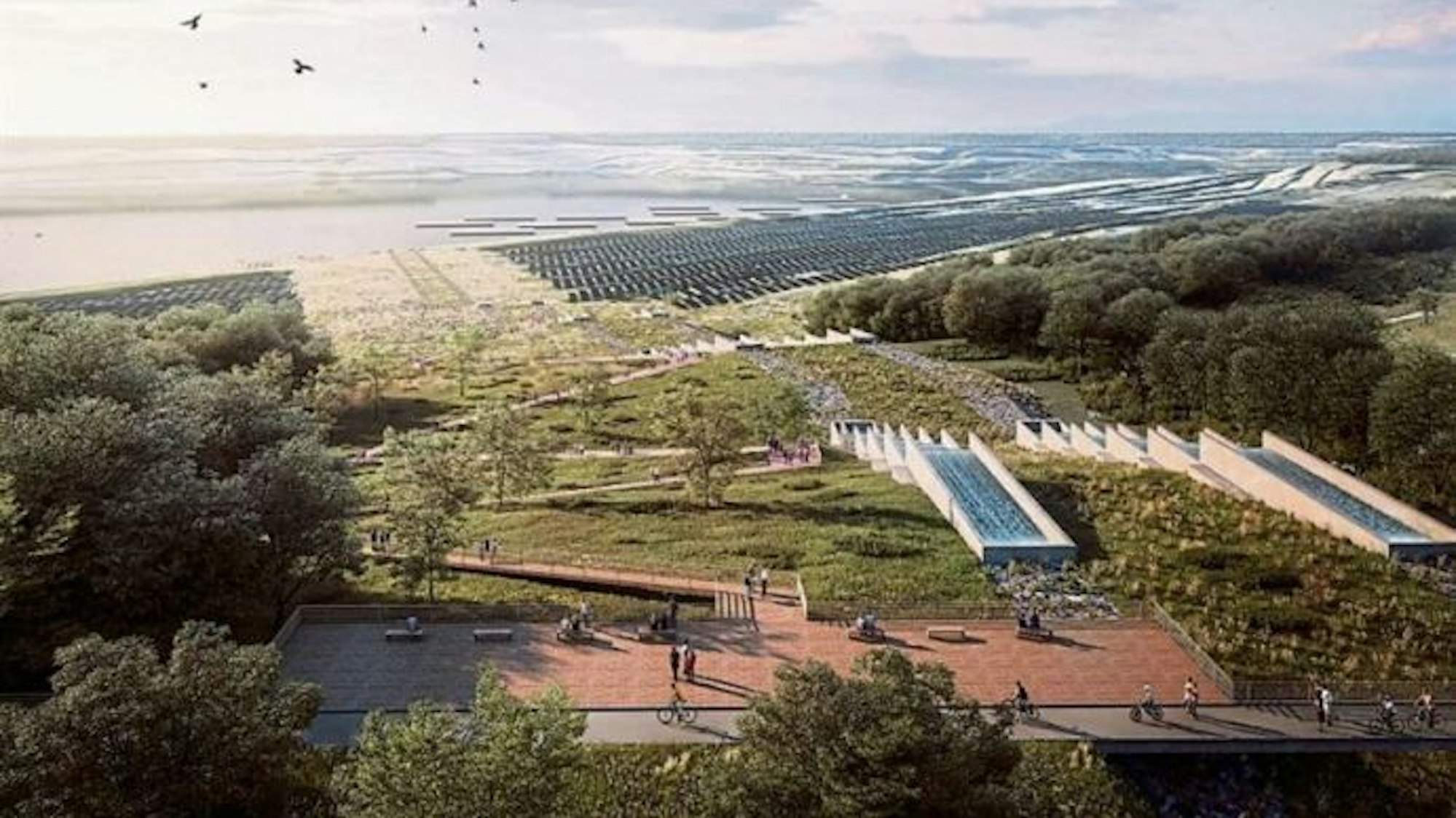 Zu sehen ist ein See mit verschiedenen Bauwerken oberhalb des Ufers.