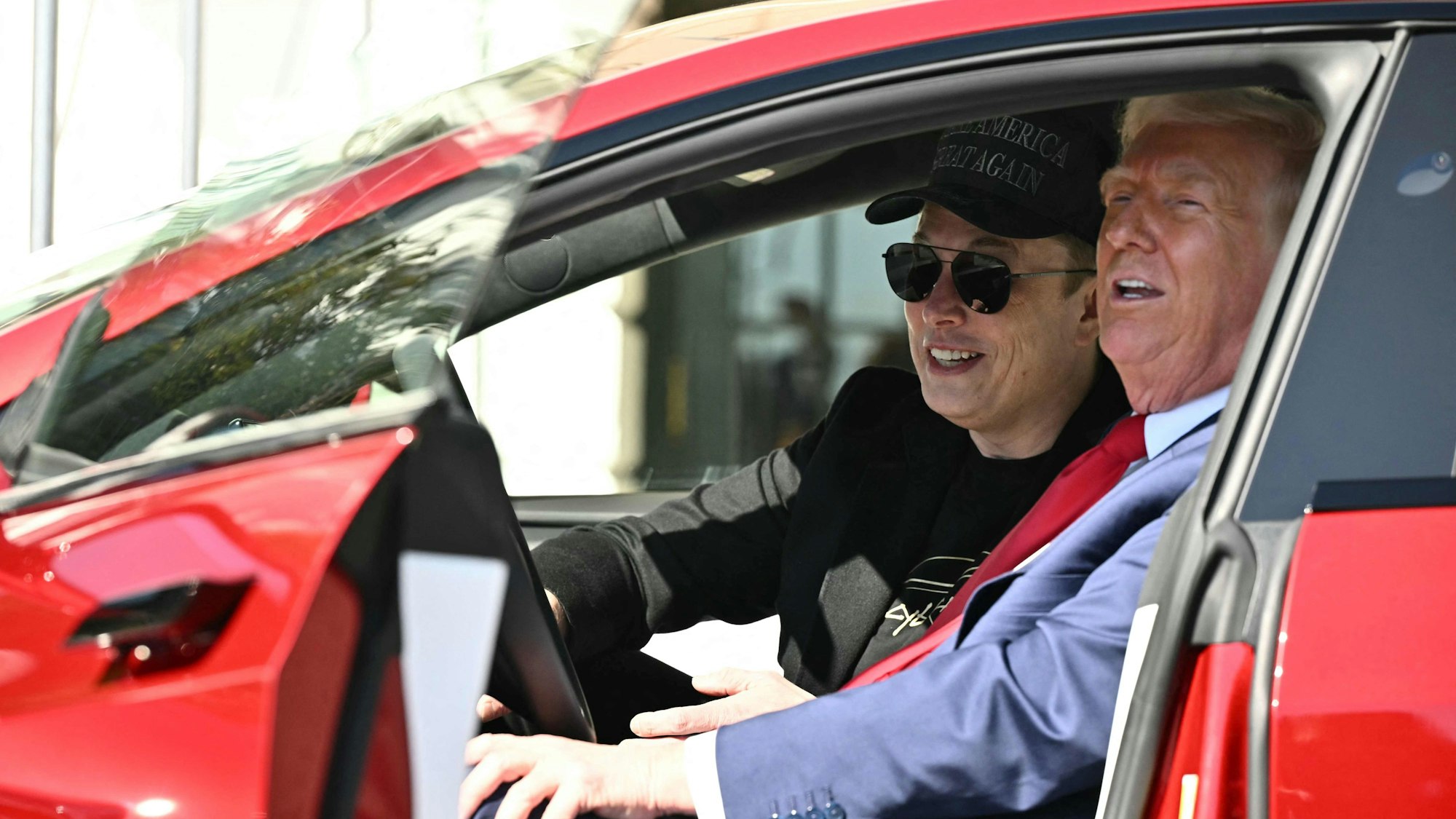 (FILES) US President Donald Trump and Tesla CEO Elon Musk speak to the press as they sit in a Tesla vehicle on the South Portico of the White House on March 11, 2025 in Washington, DC. Elon Musk will significantly scale back his Trump administration work in May to focus on Tesla, the billionaire announced April 22 as the electric vehicle maker reported a 71 percent drop in first-quarter profits.
"Probably in the next month, my time allocation to DOGE will drop significantly," Musk said at the outset of an earnings conference call, referring to his work for the "Department of Government Efficiency." (Photo by Mandel NGAN / AFP)