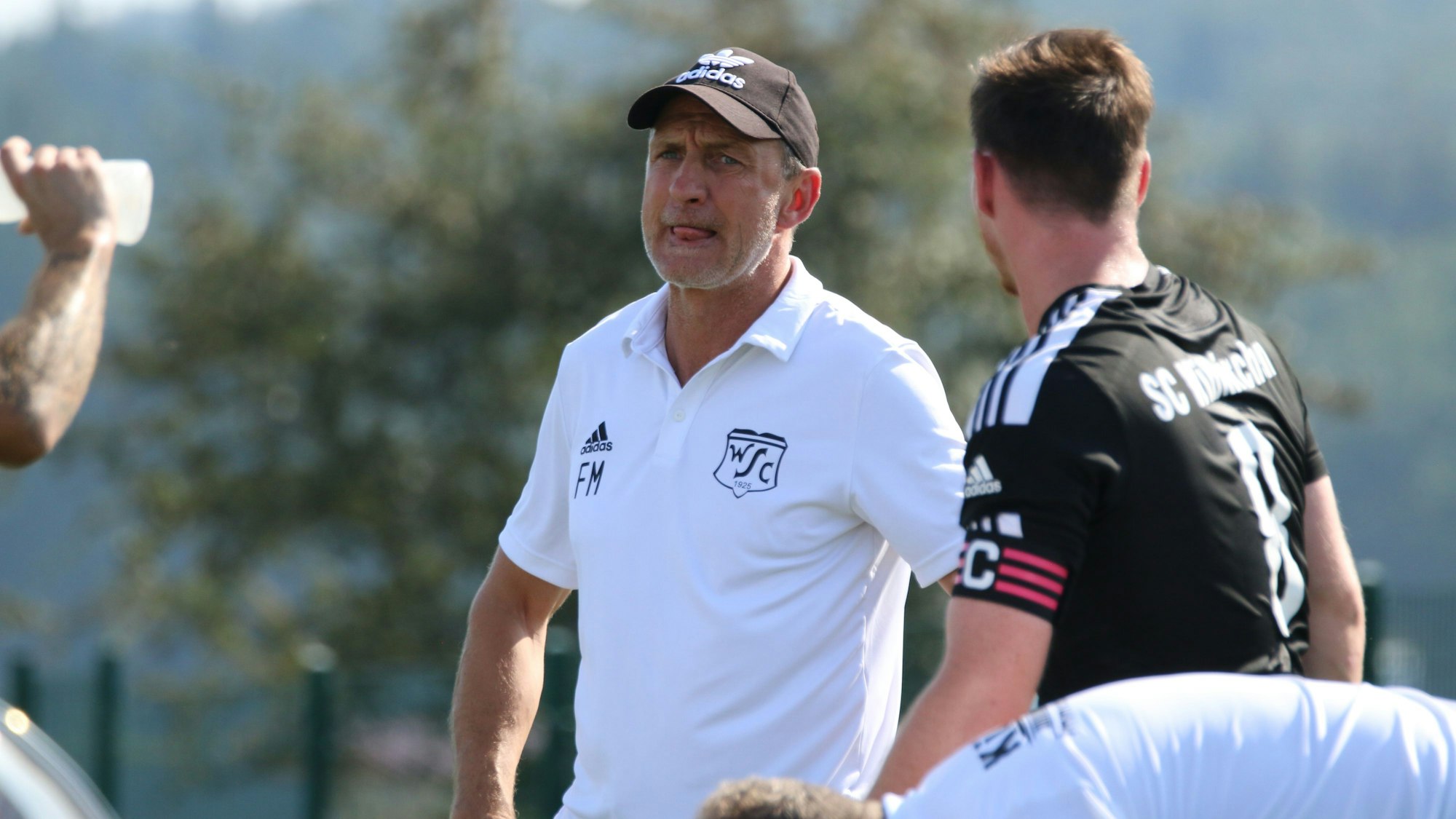 Das Bild zeigt Frank Marwitz. Er trägt eine schwarze Kappe und ein weißes Polo-Shirt.