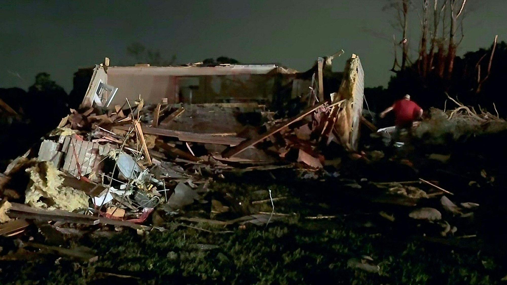 In this still image obtained from the Laurel County Fiscal Court in Kentucky, local residents search through tornado damage in Laurel County near London, Kentucky, on May17, 2025. More than 20 people have died after severe storms swept through the southern US states of Missouri and Kentucky, officials and local media reports said May 17, 2025. Kentucky governor Andy Beshear said on X that at least 14 people had died in Friday night's storms. At least seven people were killed in Missouri, the Washington Post reported. (Photo by Handout / Laurel County Fiscal Court / AFP) / RESTRICTED TO EDITORIAL USE - MANDATORY CREDIT "AFP PHOTO / Laurel County Fiscal Court" - NO MARKETING NO ADVERTISING CAMPAIGNS - DISTRIBUTED AS A SERVICE TO CLIENTS