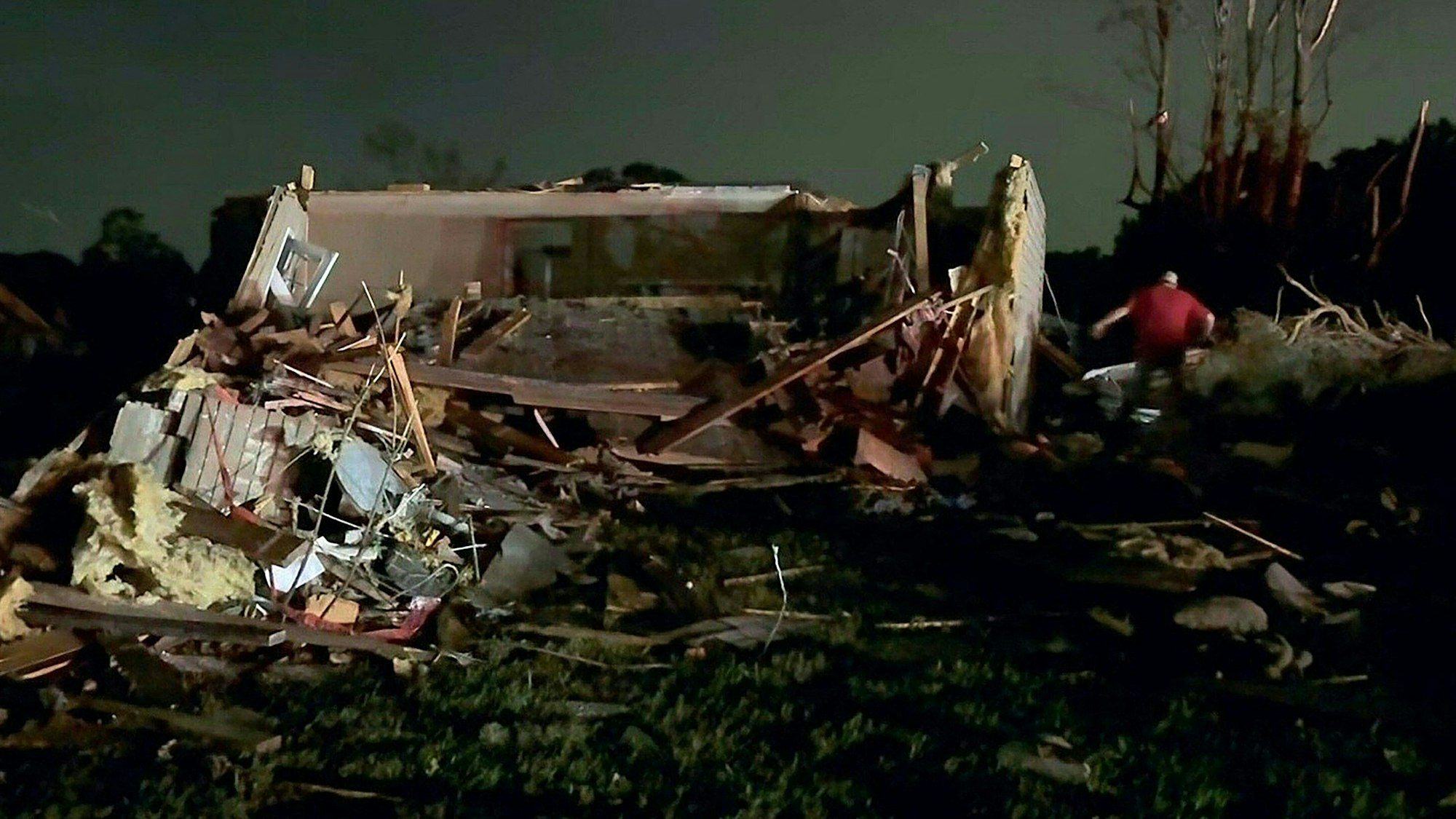 In this still image obtained from the Laurel County Fiscal Court in Kentucky, local residents search through tornado damage in Laurel County near London, Kentucky, on May17, 2025. More than 20 people have died after severe storms swept through the southern US states of Missouri and Kentucky, officials and local media reports said May 17, 2025. Kentucky governor Andy Beshear said on X that at least 14 people had died in Friday night's storms. At least seven people were killed in Missouri, the Washington Post reported. (Photo by Handout / Laurel County Fiscal Court / AFP) / RESTRICTED TO EDITORIAL USE - MANDATORY CREDIT "AFP PHOTO / Laurel County Fiscal Court" - NO MARKETING NO ADVERTISING CAMPAIGNS - DISTRIBUTED AS A SERVICE TO CLIENTS