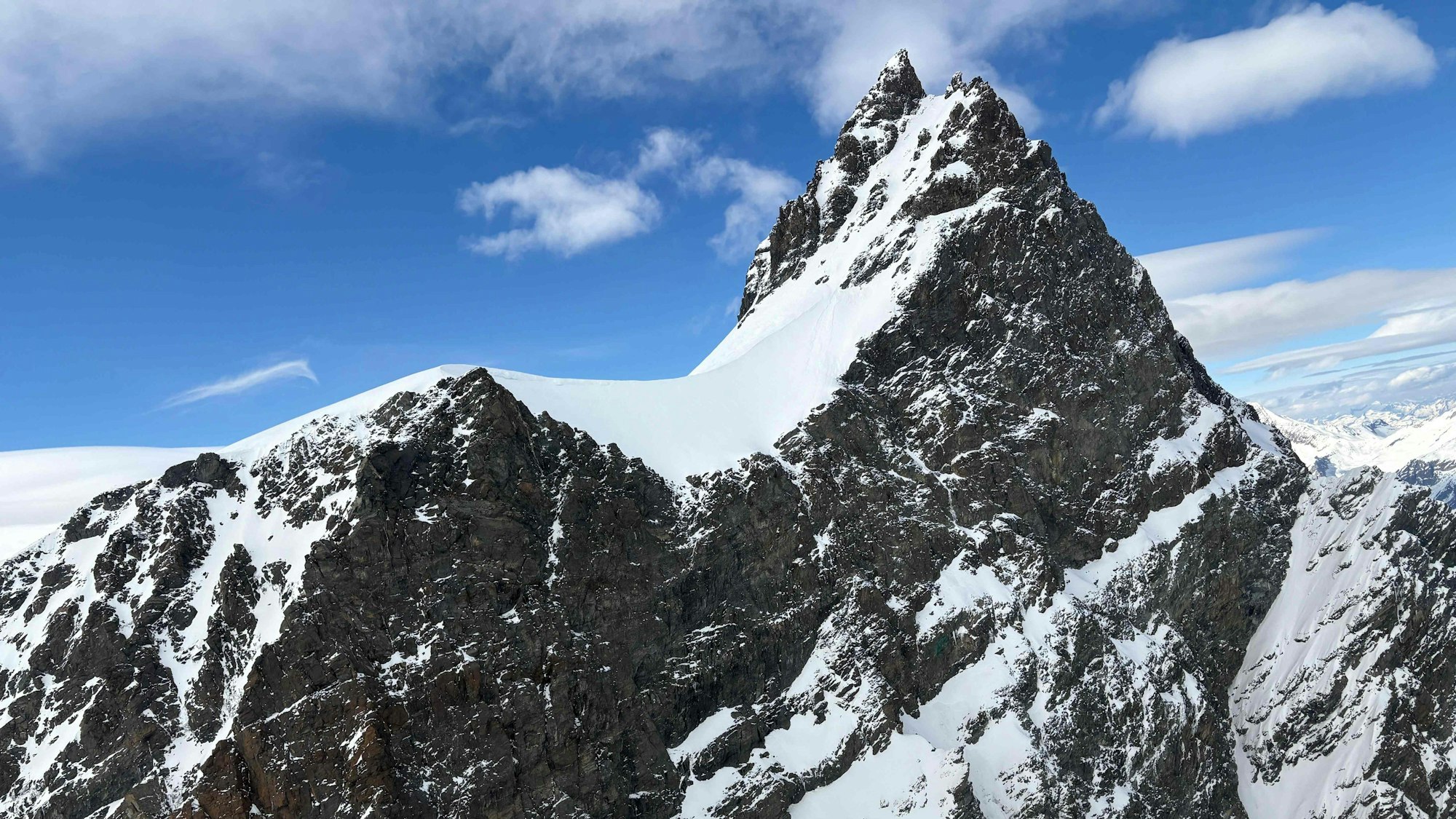 This handout photograph taken on May 24, 2025 and released on May 25, 2025 by the police of the Swiss Canton of Valais shows the Rimpfischhorn mountain peak where five skiers found dead on the Adler glacier in Zermatt region. Five skiers' bodies were found lifeless on May 24, 2025 in the Rimpfischhorn massif near the Swiss ski resort of Zermatt, the police of the canton of Valais said in a statement published the next day. Formal identification of the victims, who were on the Adler glacier, is still in progress, the police said. (Photo by HANDOUT / POLICE CANTONALE VALAISANNE / AFP) / RESTRICTED TO EDITORIAL USE - MANDATORY CREDIT "AFP PHOTO / POLICE CANTONALE VALAISANNE" - HANDOUT - NO MARKETING NO ADVERTISING CAMPAIGNS - DISTRIBUTED AS A SERVICE TO CLIENTS