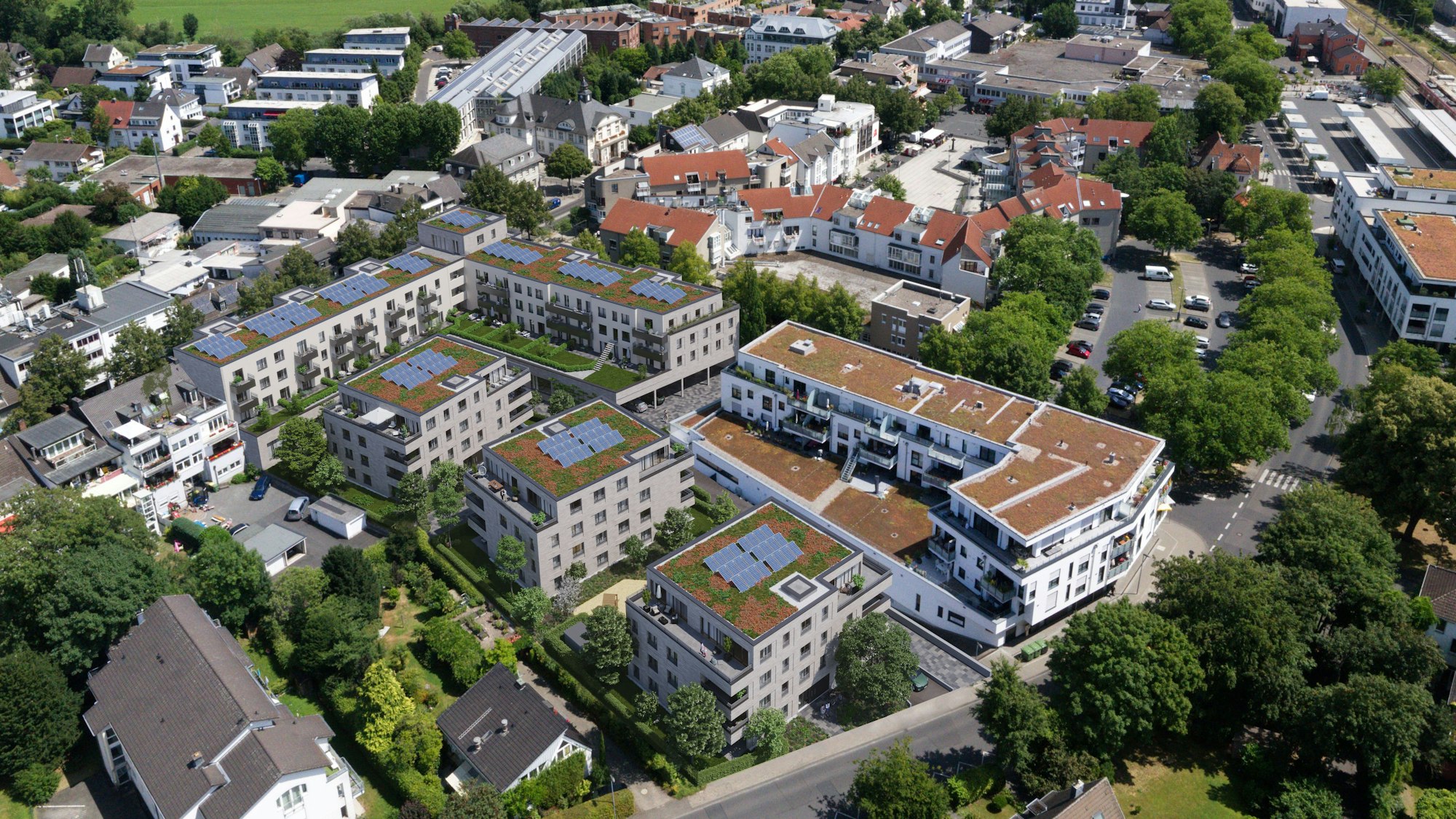 Blick aus südlicher Vogelperspektive auf die geplante und bestehende Bebauung mit der Mozartstraße im Vordergrund.