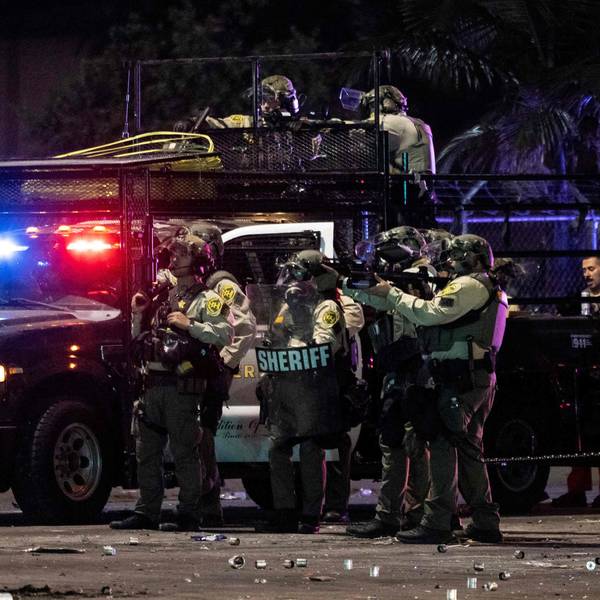 Sheriff deputies shoot at demonstrators with less lethal ammunitions during a protest following federal immigration operations, in the Compton neighborhood of Los Angeles, California on June 7, 2025. US President Donald Trump deployed 2,000 troops on June 7 to handle escalating protests against immigration enforcement raids in the Los Angeles area, a move the state's governor termed "purposefully inflammatory." Federal agents clashed with angry crowds in a Los Angeles suburb as protests stretched into a second night Saturday, shooting flash-bang grenades and shutting part of a freeway amid raids on undocumented migrants, reports said. (Photo by ETIENNE LAURENT / AFP)
