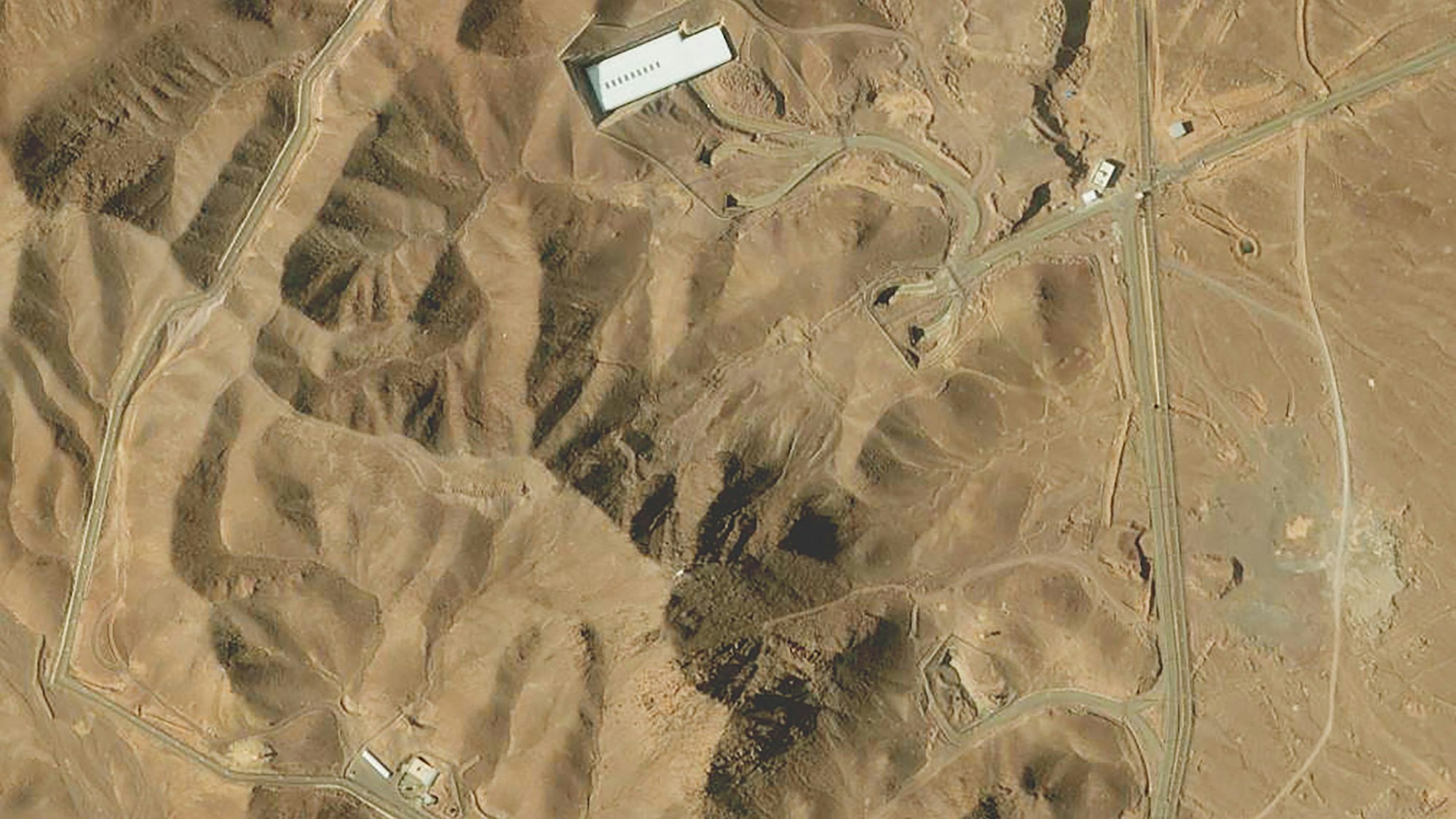 This handout satellite image provided by Maxar Technologies and taken on February 12, 2025 shows an overview of the Fordo (Fordow) uranium enrichment facility, south of the capital Tehran. Iranian authorities said on June 13 that nuclear sites at Fordow and Isfahan have not been hit in Israel strikes, according to the head of the International Atomic Energy Agency. (Photo by Satellite image ©2021 Maxar Technologies / AFP) / RESTRICTED TO EDITORIAL USE - MANDATORY CREDIT "AFP PHOTO / Satellite image ©2021 Maxar Technologies " - NO MARKETING - NO ADVERTISING CAMPAIGNS - DISTRIBUTED AS A SERVICE TO CLIENTS - The watermark may not be removed/cropped / THE WATERMARK MAY NOT BE REMOVED/CROPPED