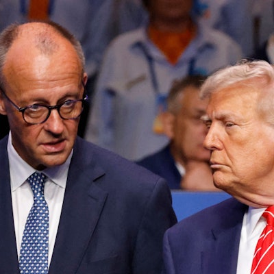 Germanys Chancellor Friedrich Merz (L) speaks with US President Donald Trump before the start of the North Atlantic Council plenary meeting at the North Atlantic Treaty Organisation (NATO) summit in The Hague on June 25, 2025. (Photo by Ludovic MARIN / POOL / AFP)