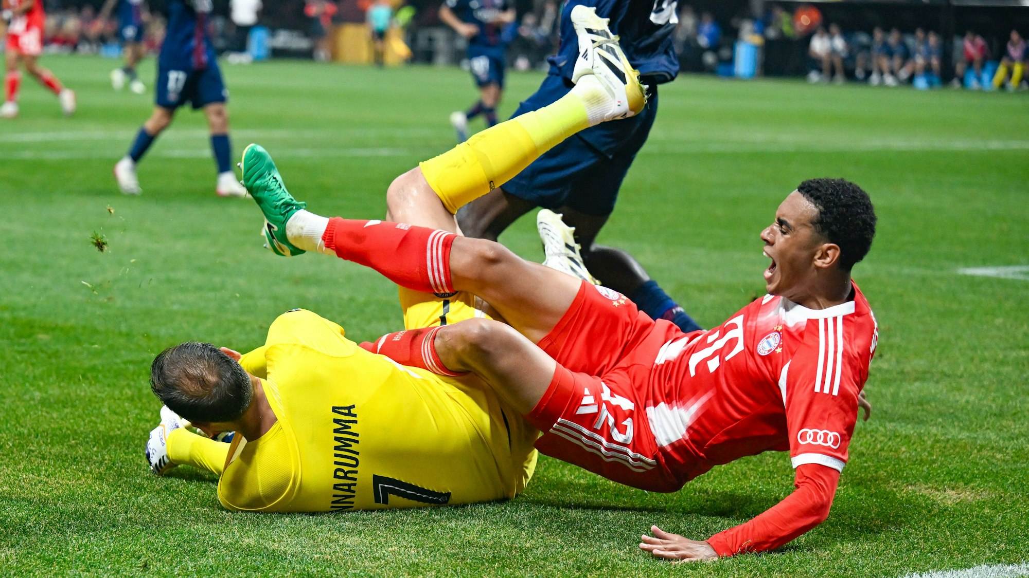 ATLANTA, GA Ð JULY 05: Bayern Munich midfielder Jamal Musiala 42 is entangled with PSG goalkeeper Gianluigi Donnarumma 1 during the FIFA Club World Cup match between FC Bayern Munich and Paris Saint-Germain FC on July 5th, 2025 at Mercedes-Benz Stadium in Atlanta, GA. Photo by Rich von Biberstein/Icon Sportswire SOCCER: JUL 05 FIFA Club World Cup Quarter-final PSG vs Bayern Munchen EDITORIAL USE ONLY Icon250705001