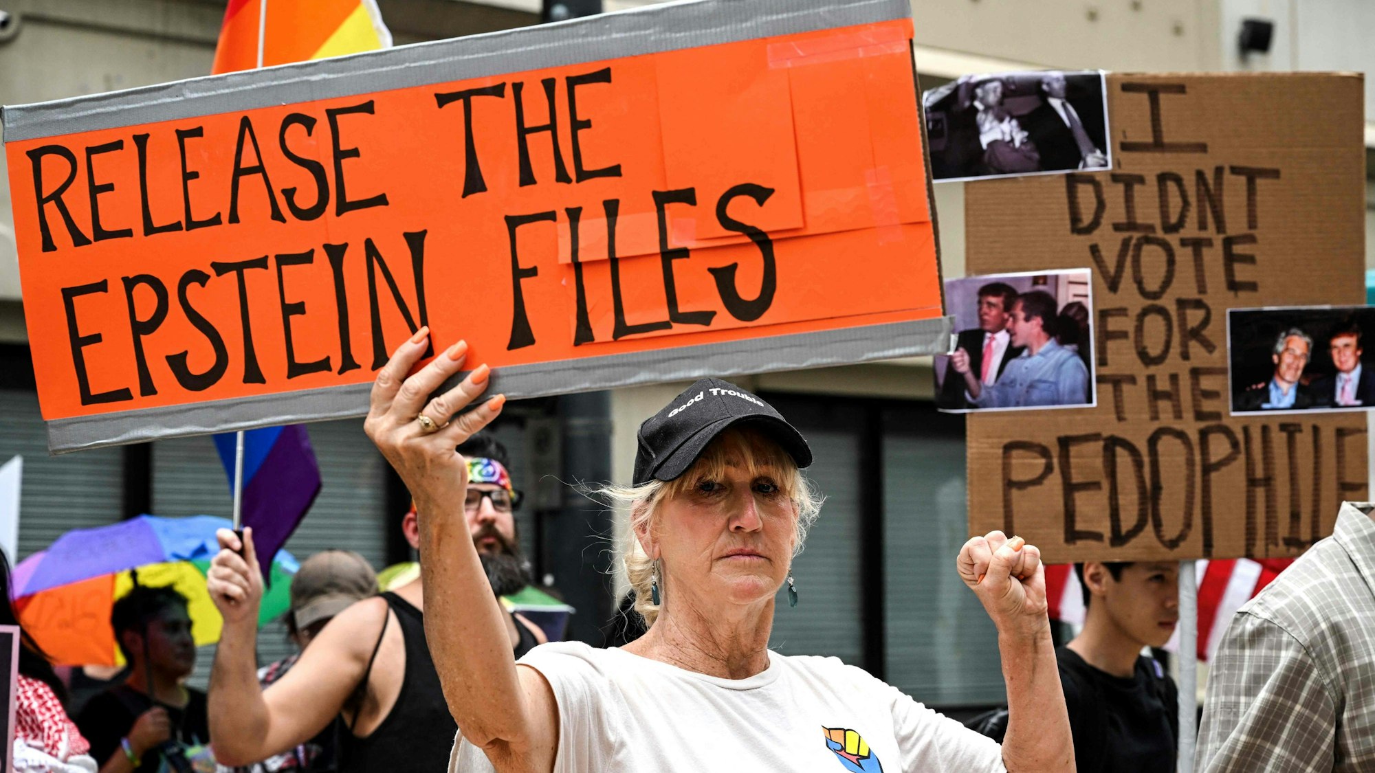 People holds signs calling for the release of files regarding late sex offender Jeffrey Epstein participate in a protest