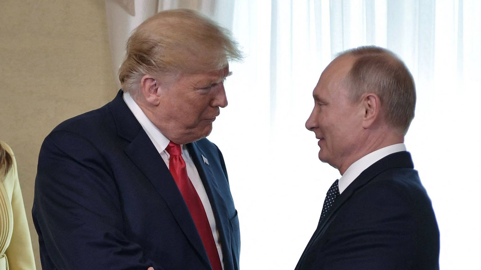 TOPSHOT - (FILES) US President Donald Trump (L) shakes hands with Russia's President Vladimir Putin ahead of a meeting in Helsinki, on July 16, 2018. US President Donald Trump and Russian counterpart Vladimir Putin could meet for a summit as early as next week, the Kremlin said on August 7, 2025. The meeting would be the first between a sitting US and Russian president since Joe Biden met Putin in Geneva in June 2021, and comes as Trump seeks to broker an end to Russia's military assault on Ukraine. (Photo by Alexey NIKOLSKY / Sputnik / AFP)