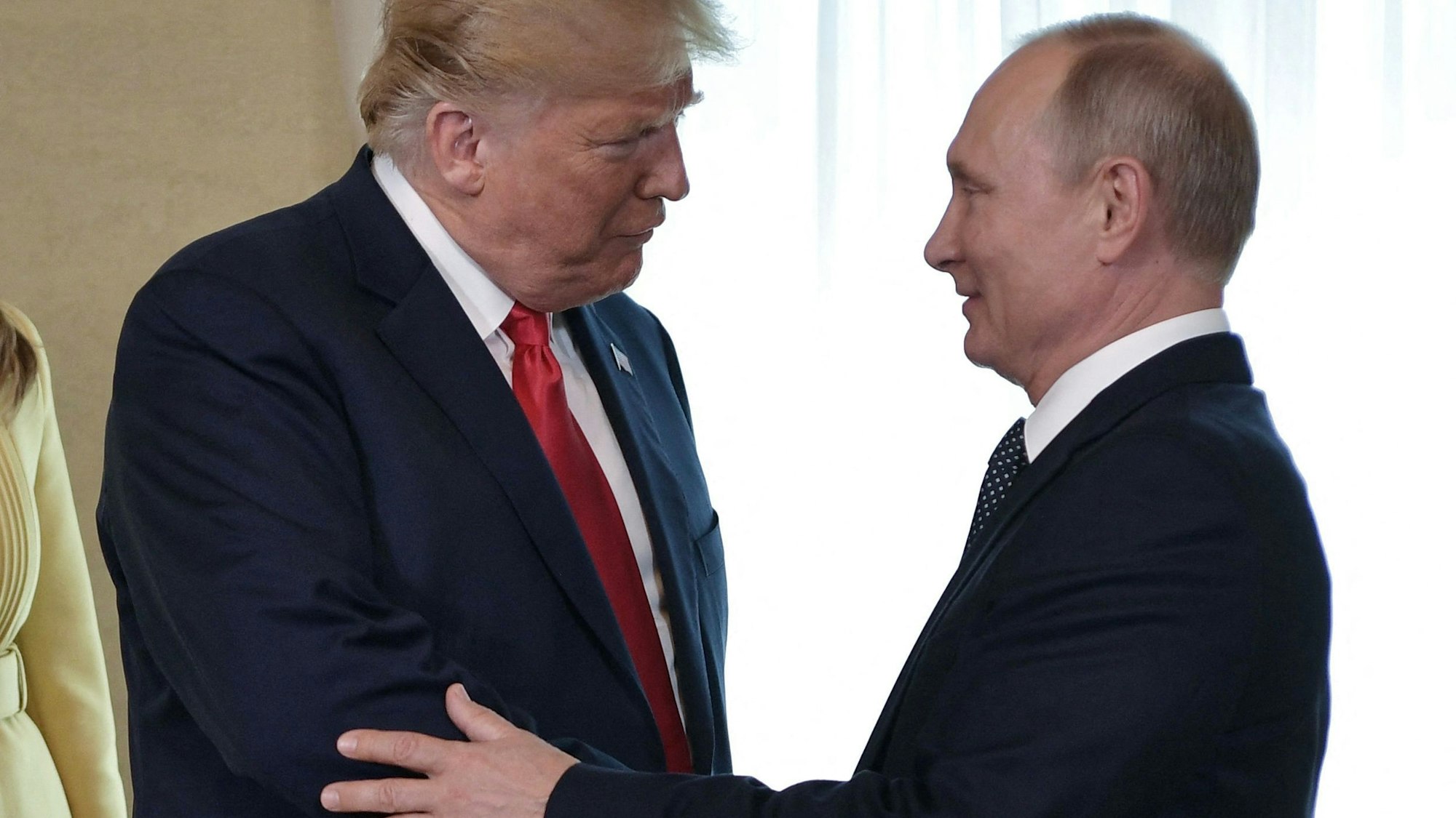 TOPSHOT - (FILES) US President Donald Trump (L) shakes hands with Russia's President Vladimir Putin ahead of a meeting in Helsinki, on July 16, 2018. US President Donald Trump and Russian counterpart Vladimir Putin could meet for a summit as early as next week, the Kremlin said on August 7, 2025. The meeting would be the first between a sitting US and Russian president since Joe Biden met Putin in Geneva in June 2021, and comes as Trump seeks to broker an end to Russia's military assault on Ukraine. (Photo by Alexey NIKOLSKY / Sputnik / AFP)
