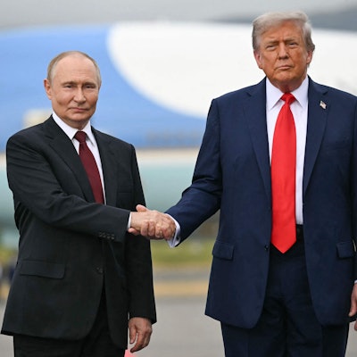TOPSHOT - US President Donald Trump greets Russian President Vladimir Putin on the tarmac after they arrived at Joint Base Elmendorf-Richardson in Anchorage, Alaska, on August 15, 2025. Putin is in Alaska at the invitation of Trump in his first visit to a Western country since he ordered the 2022 invasion of Ukraine that has killed tens of thousands of people. (Photo by ANDREW CABALLERO-REYNOLDS / AFP)