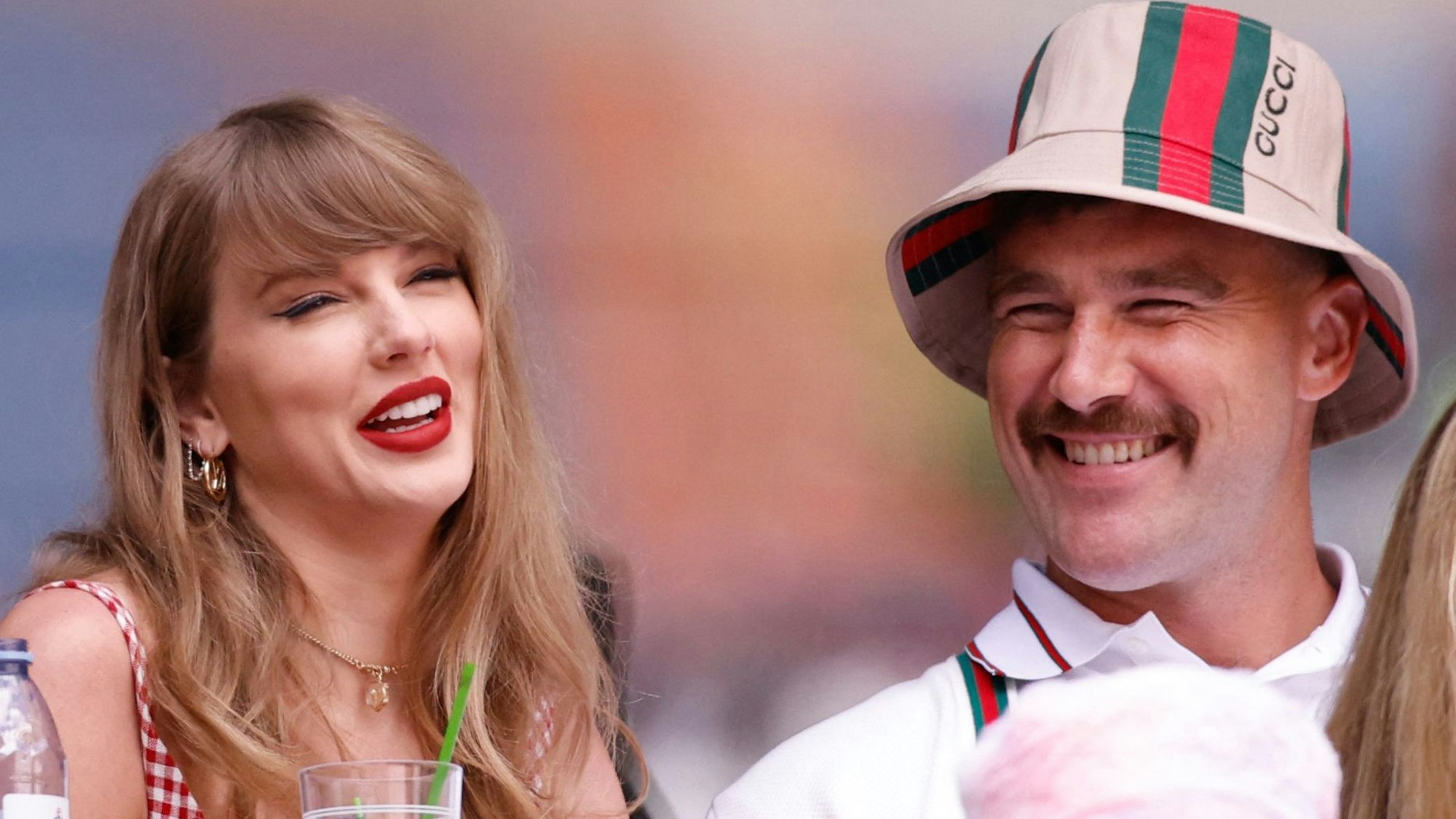 (FILES) US singer-songwriter Taylor Swift (L) and boyfriend US NFL football player Travis Kelce attend the men's final match between USA's Taylor Fritz and Italy's Jannik Sinner on day fourteen of the US Open tennis tournament at the USTA Billie Jean King National Tennis Center in New York City, on September 8, 2024. Pop superstar Taylor Swift and American football player Travis Kelce announced their engagement on August 26, 2025, setting the stage for a high-profile wedding for the celebrity couple. A joint post on their Instagram pages showed pictures of Kelce on one knee making his marriage proposal in a flower-laden garden, and then Swift, 35, displaying a large diamond ring. (Photo by Kena Betancur / AFP)
