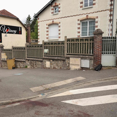 This photograph taken on August 30, 2025, shows blood stains on the road outside the bar 'La Winery', the site of a deadly car ramming in the northwestern French town of Evreux in Normandy. A man intentionally ploughed his car into a crowd outside a wine bar in Evreux after an altercation in the early hours of August 30, 2025, killing one person and injuring five others, two of them critically, prosecutors told AFP. (Photo by Xavier GALIANA / AFP)