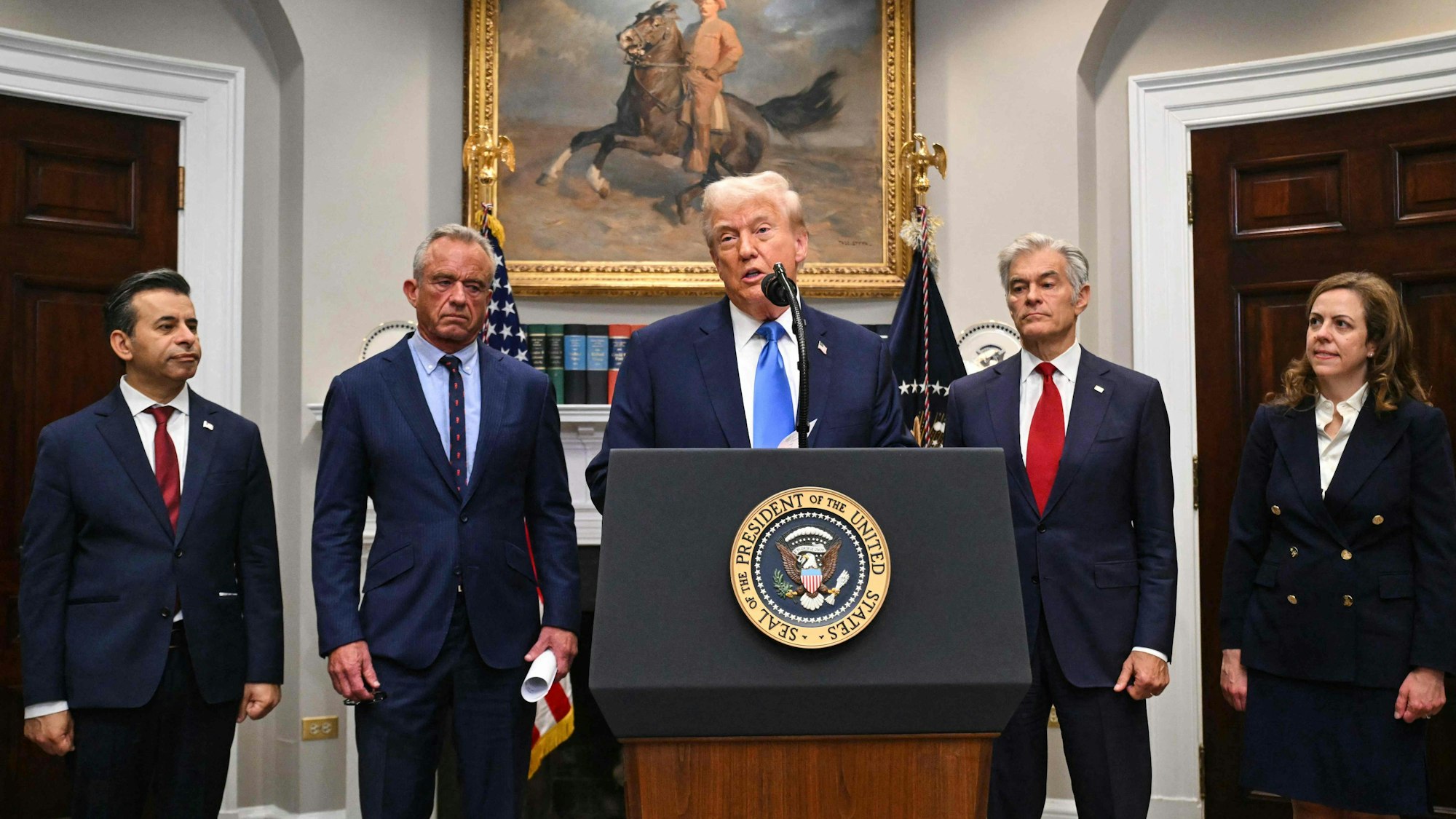US President Donald Trump speaks during an event about autism in the Roosevelt Room of the White House in Washington, DC on September 22, 2025. Also pictured, L/R, Food and Drug Administration Commissioner Martin Makary, Secretary of Health and Human Services Robert F. Kennedy Jr., Medicare and Medicaid Administrator Mehmet Oz and Dr. Dorothy Frank. (Photo by SAUL LOEB / AFP)