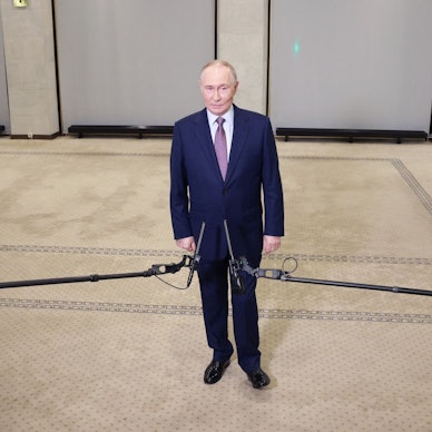 In this pool photograph distributed by the Russian state agency Sputnik, Russia's President Vladimir Putin meets with the media after attending a meeting of the Russian Geographical Society in Moscow on October 23, 2025. (Photo by Alexander SHCHERBAK / POOL / AFP)
