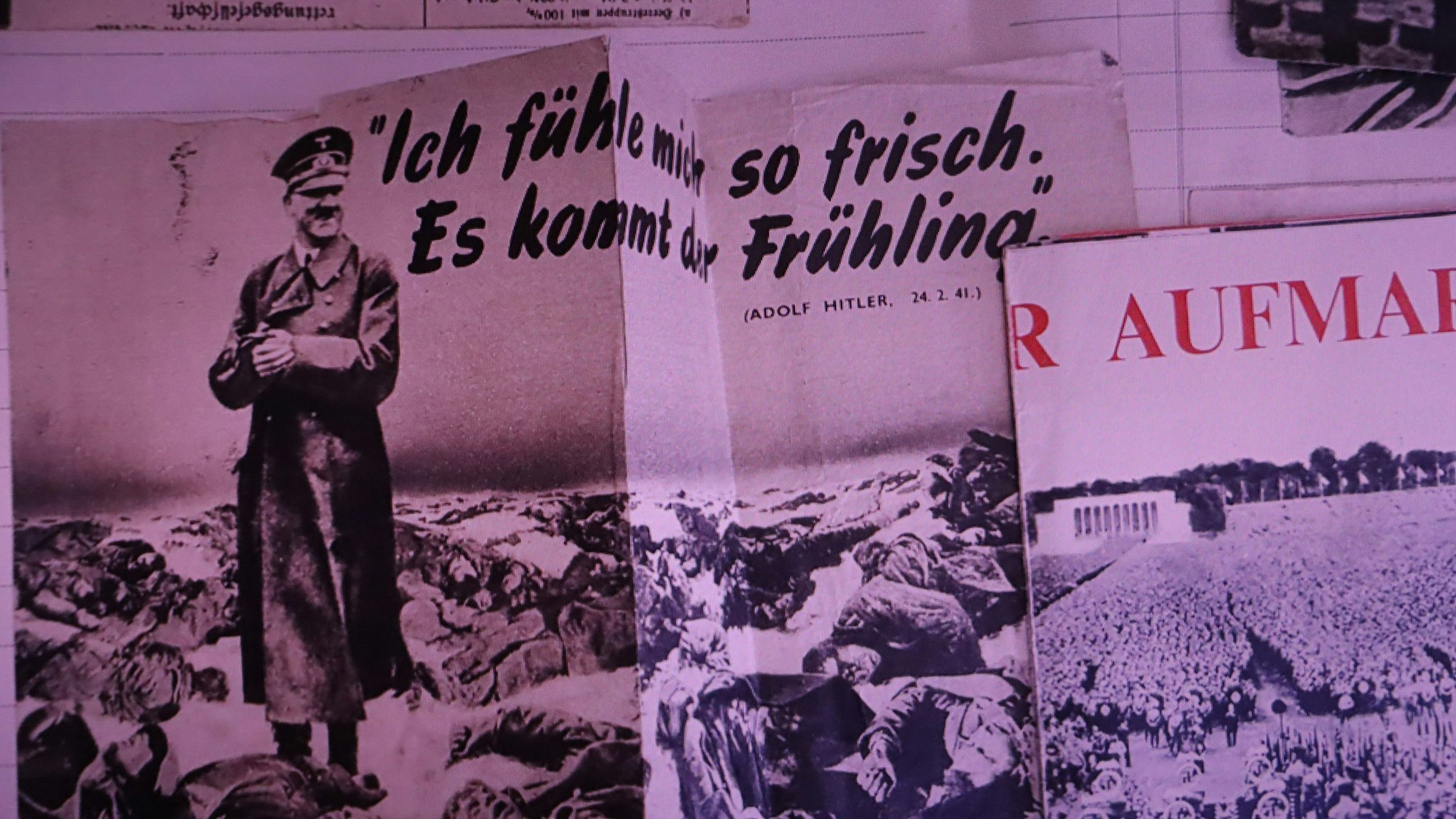 Hitler lächelt umringt von Leichen - Motiv auf einem britischen Flugblatt.