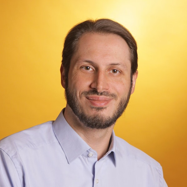 Auf dem Bild ist das Portrait eines Mannes zu sehen.