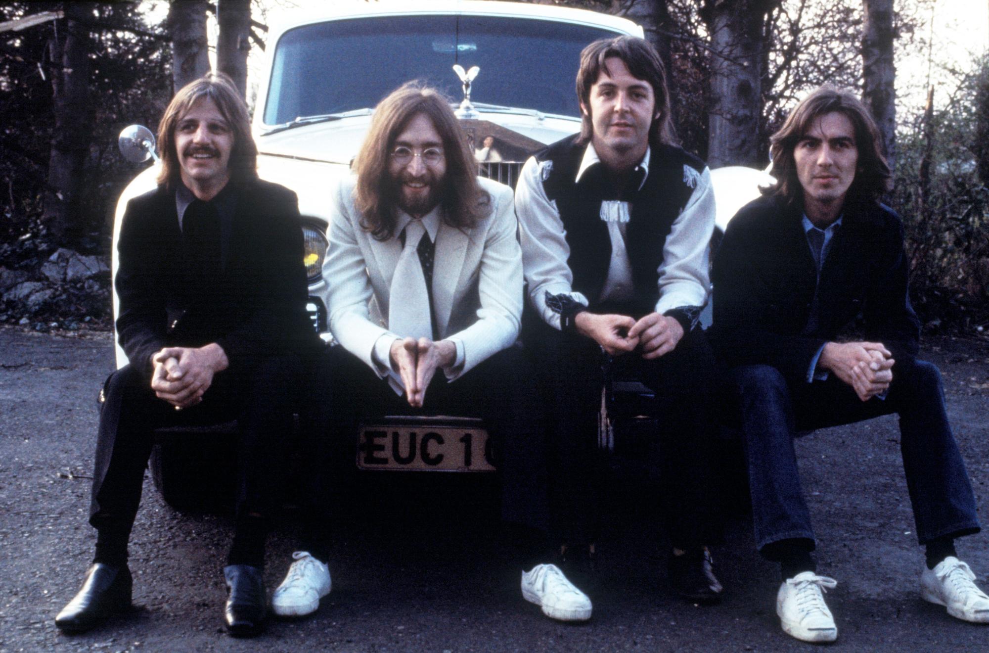 Auf dem Foto sind die vier Musiker der Beatles zu sehen.