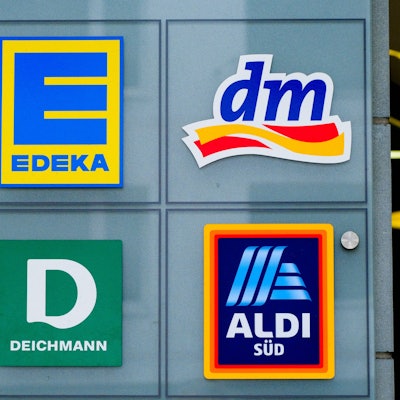 Logos von Edeka und dm.