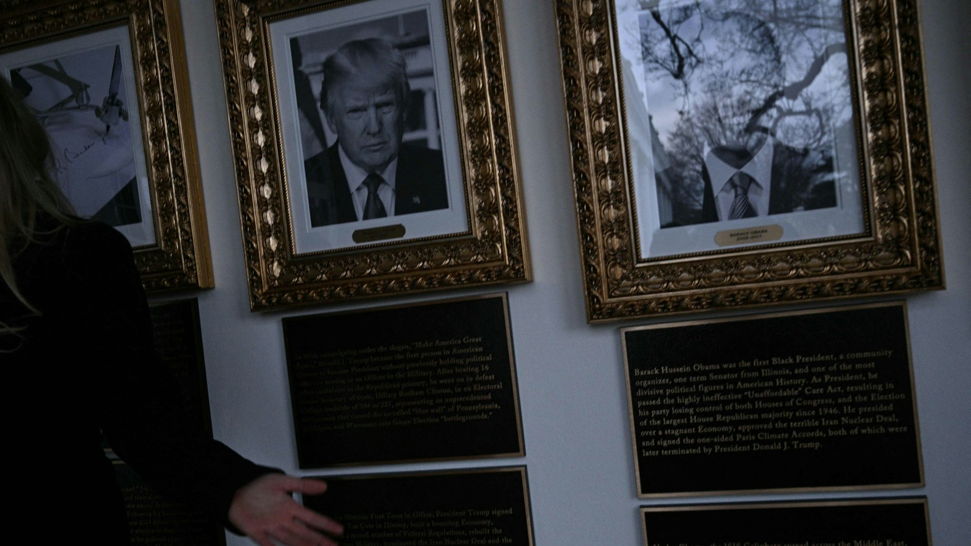 Portraits with new plaques of explanatory text are seen on the Presidential Walk of Fame on the Colonnade of the White House in Washington, DC, on December 17, 2025. (Photo by Brendan SMIALOWSKI / AFP)
