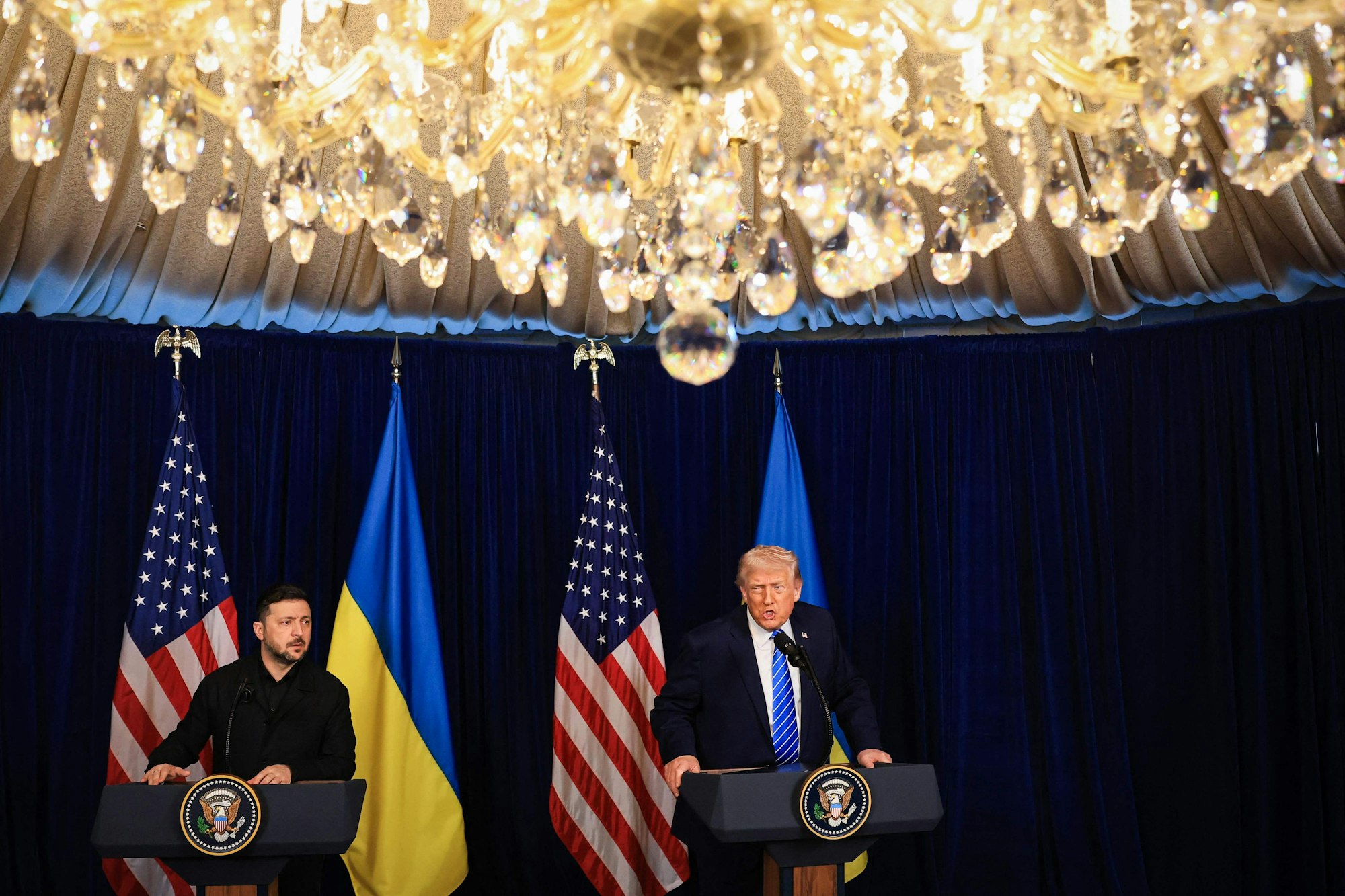 PALM BEACH, FLORIDA - DECEMBER 28: U.S. President Donald Trump and Ukrainian President Volodymyr Zelensky hold a press conference following their meeting at Trumps Mar-a-Lago club on December 28, 2025 in Palm Beach, Florida. Trump invited Zelensky to his private club to work on the U.S.-proposed peace plan to end the war in Ukraine, as the conflict approaches four years since the sudden full-scale invasion by Russia on February 24, 2022. Joe Raedle/Getty Images/AFP (Photo by JOE RAEDLE / GETTY IMAGES NORTH AMERICA / Getty Images via AFP)