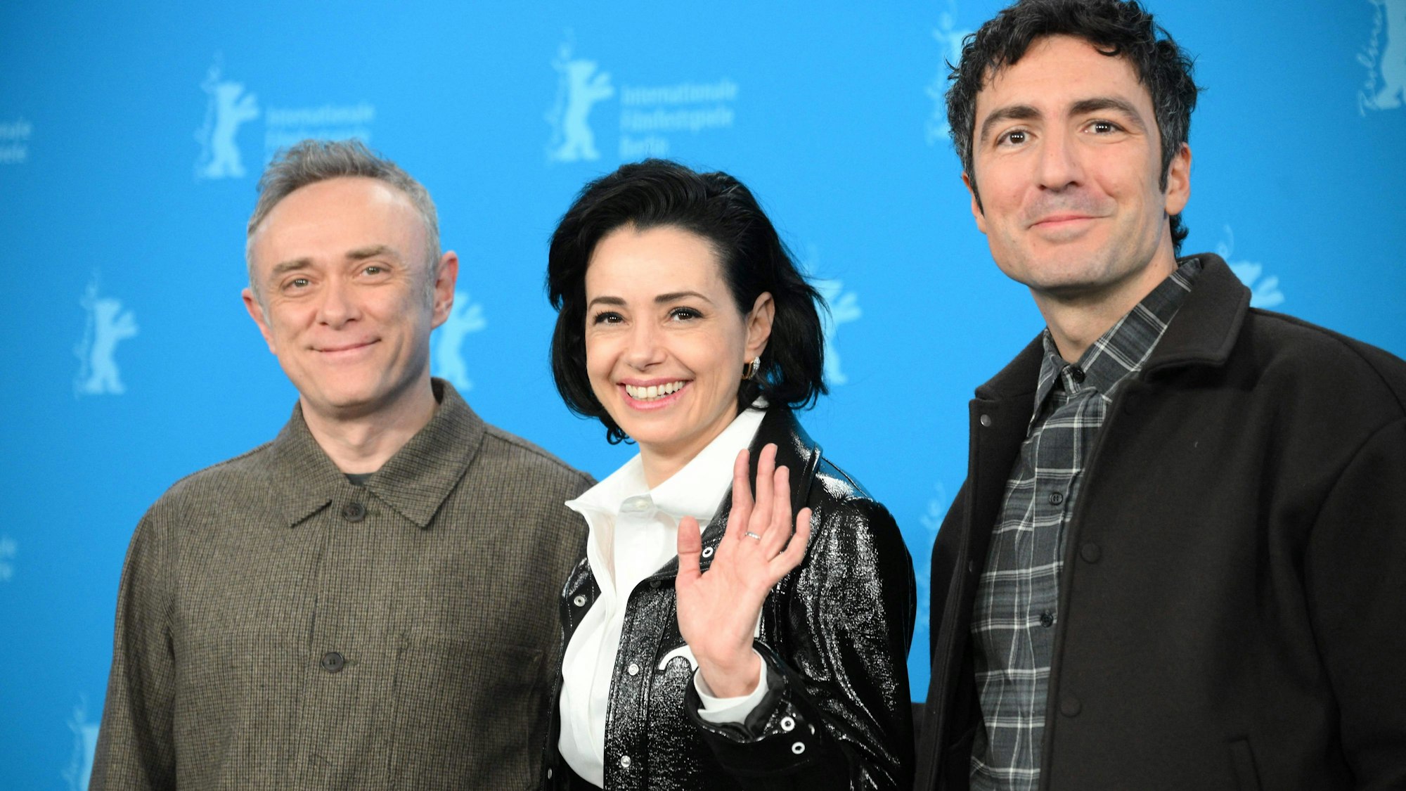 Turkish actor Tansu Bicer (L), Turkish actress Ozgu Namal (C) and German director Ilker Catak (R) pose during a photo call for the film "Gelbe Briefe" (Yellow Letters) presented in competition at the 76th Berlinale, Europe's first major film festival of the year, in Berlin on February 13, 2026. (Photo by RALF HIRSCHBERGER / AFP)